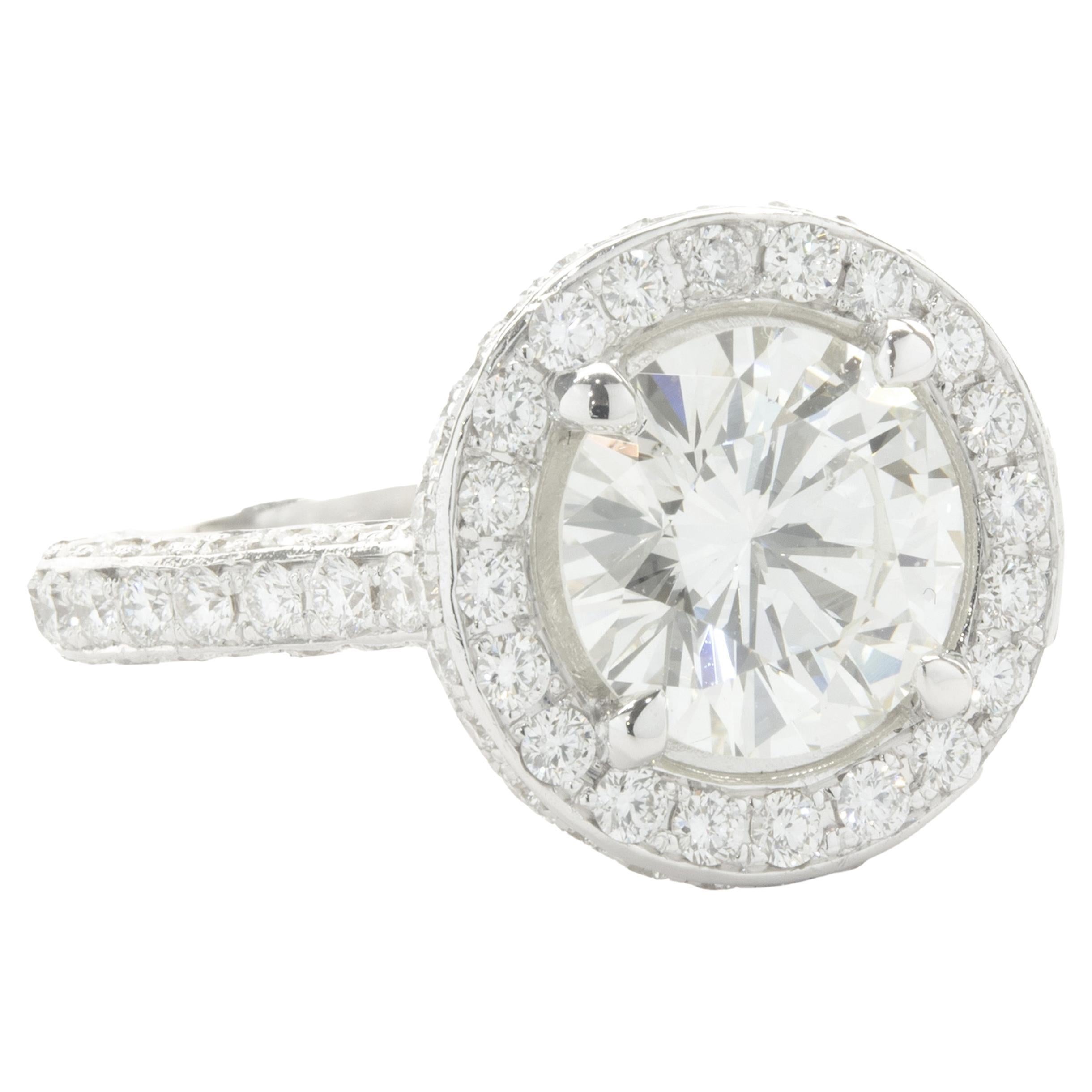 Designer: custom
Material: 14K white gold 
Diamond: 1 round brilliant cut = 2.25ct
Color: J
Clarity: SI2
Diamond: 152 round brilliant = 1.52cttw 
Color: G 
Clarity: VS2
Ring Size: 5 (please allow two additional shipping days for sizing