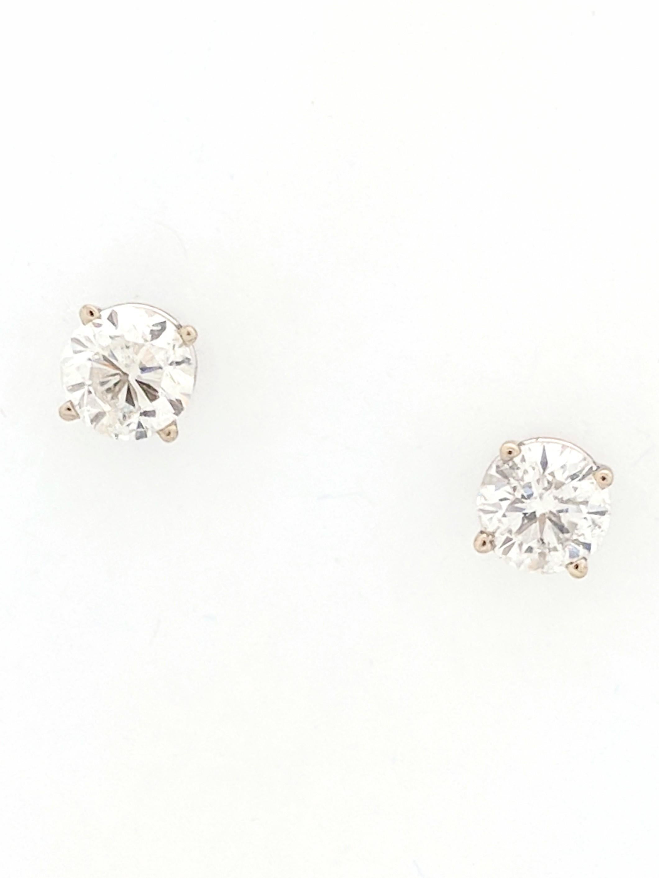 You are viewing a Beautiful Pair of Diamond Stud Earrings. These earrings are crafted from 14k white gold and weighs 1.1 grams. Each earring features approximately (1) 0.915ct natural round brilliant cut diamond which measures 6mm for an estimated