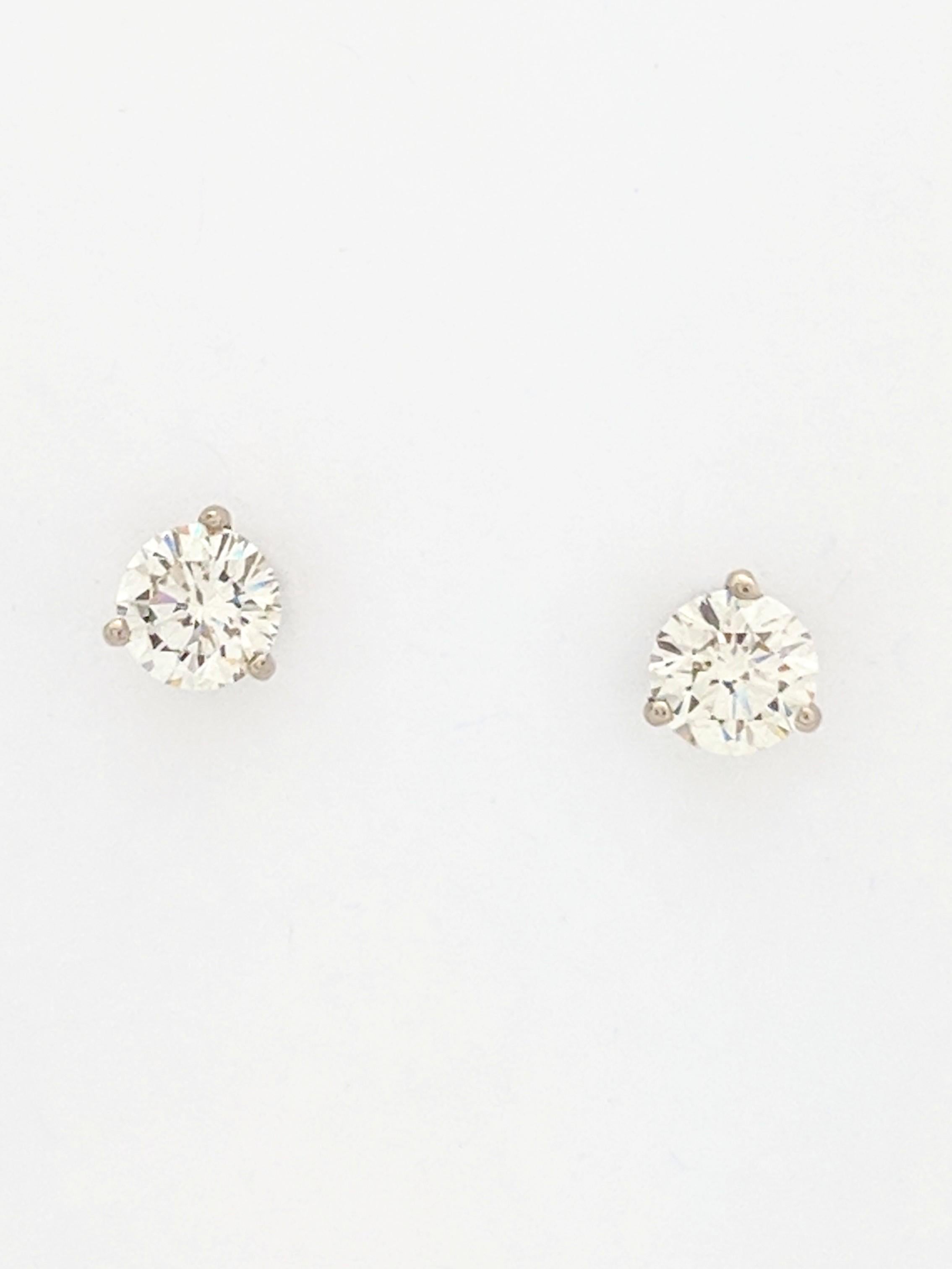 You are viewing a Beautiful Pair of Diamond Stud Earrings. These earrings are crafted from 14k white gold and weighs 1.1 grams. Each earring features approximately (1) 0.815ct natural round brilliant cut diamond which measures 6mm for an estimated