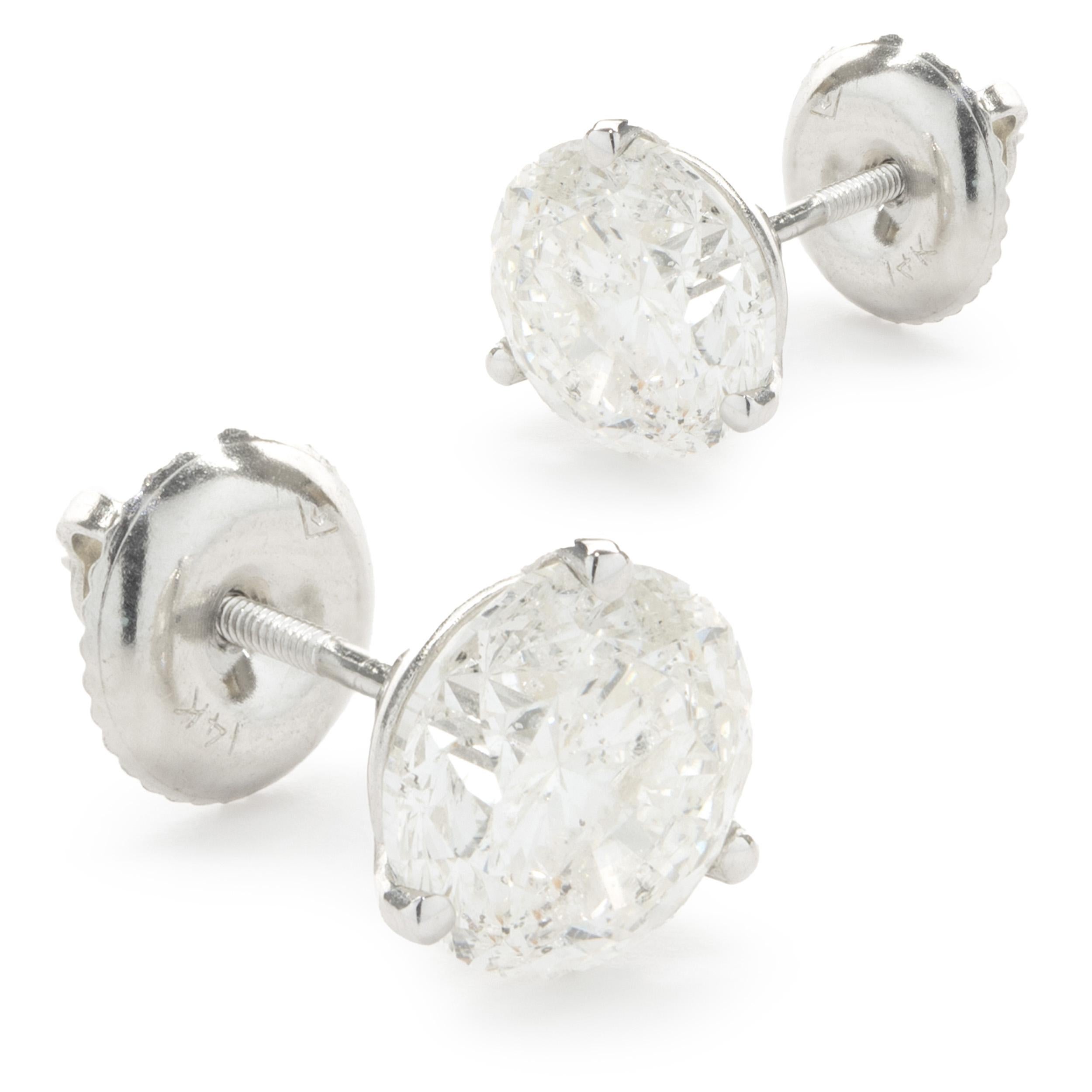Material: 14k white gold
Diamonds: 2 round brilliant cut = 3.04cttw
Color: G / H
Clarity: I1
Dimensions: earrings measure approximately 7.19mm in diameter
Fastenings: post with screw backs
Weight: 1.47 grams