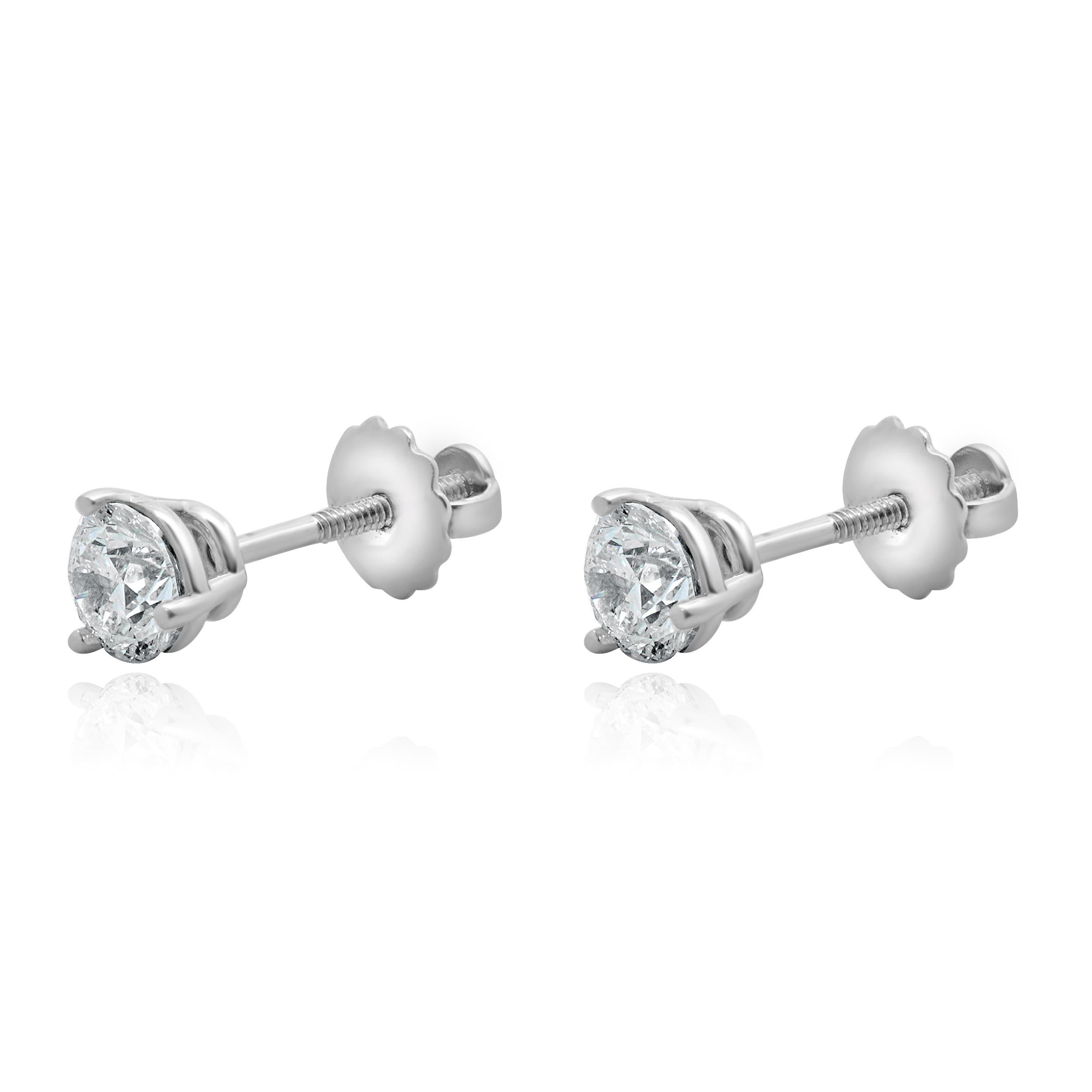 Material: White Gold
Diamonds: 2 round brilliant cut = 0.98cttw
Color: E / F 
Clarity: SI1
Dimensions: earrings measure approximately 7.20mm in diameter
Fastenings: friction
Weight: 1.02 grams