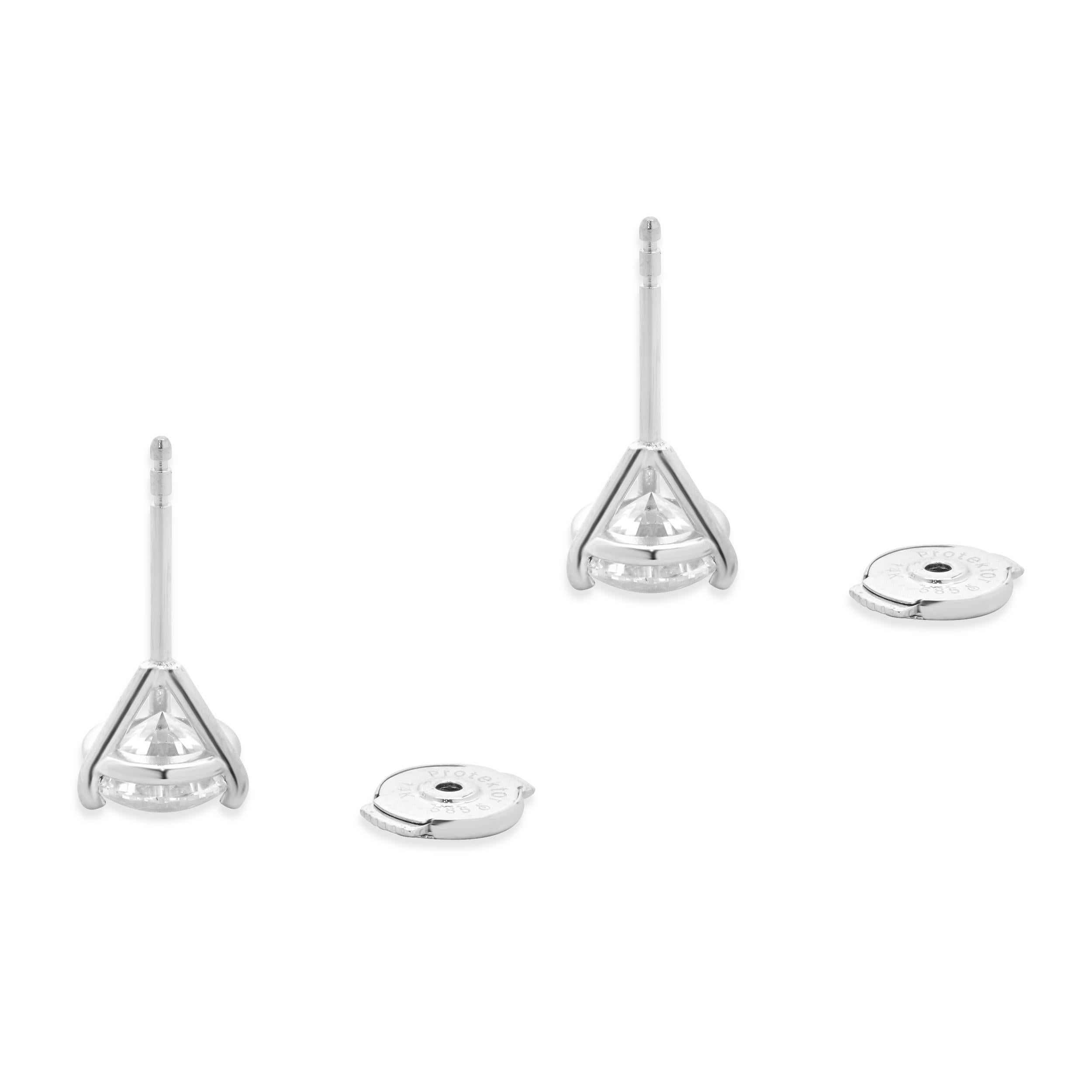 Material: 14K white gold
Diamonds: 1 round brilliant cut = 1.11ct
Color: G
Clarity: SI2
GIA: 5231464322
Diamonds: 1 round brilliant cut = 1.00ct
Color: H
Clarity: I1
GIA: 2231464320
Dimensions: earrings measure approximately 6.6mm in