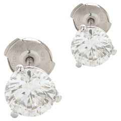 Clous d'oreilles en or blanc 14 carats avec diamants taille brillant rond