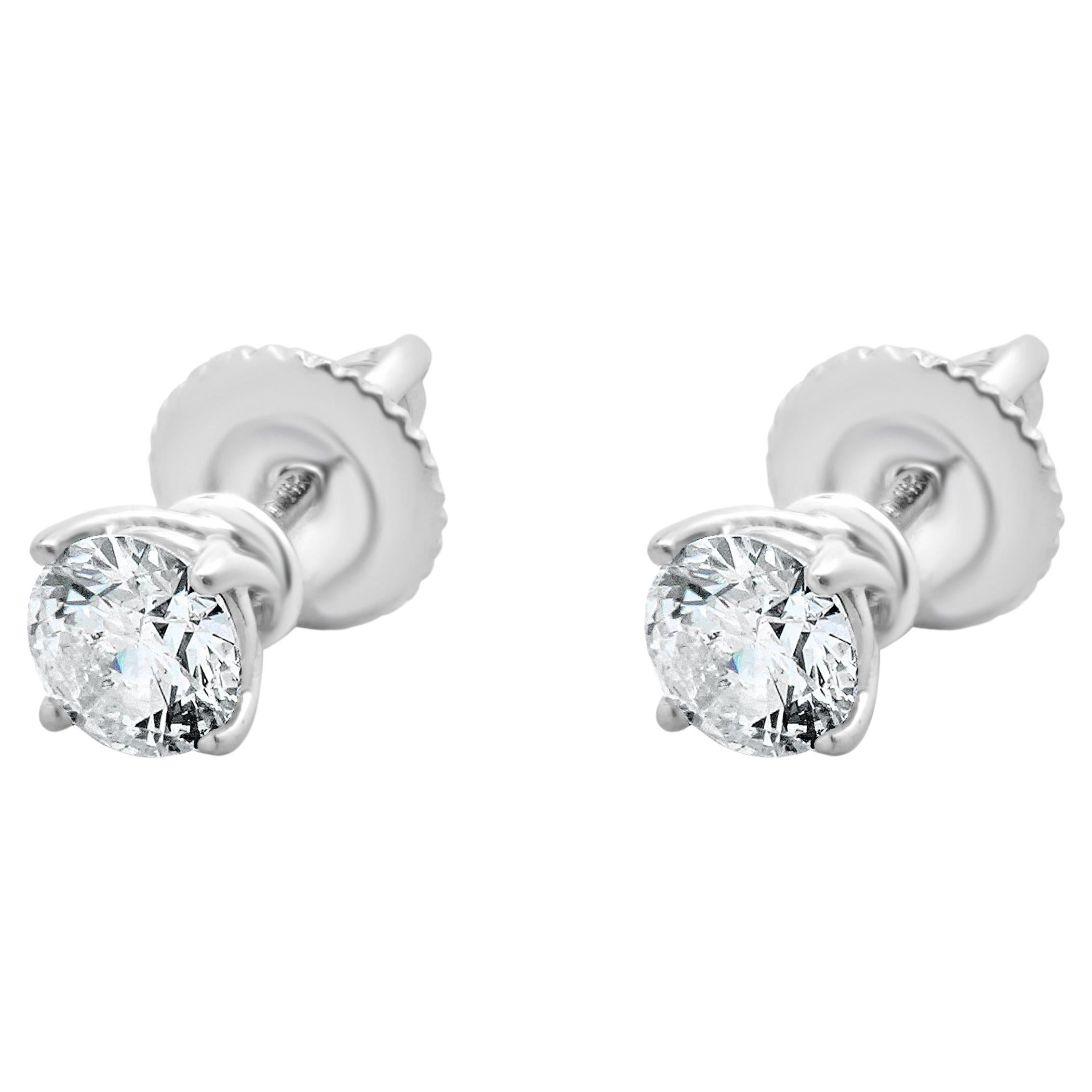 Clous d'oreilles en or blanc 14 carats avec diamants taille brillant rond
