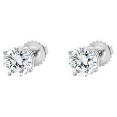 Clous d'oreilles en or blanc 14 carats avec diamants taille brillant rond
