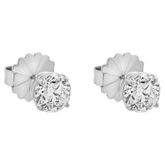 Clous d'oreilles en or blanc 14 carats avec diamants taille brillant rond