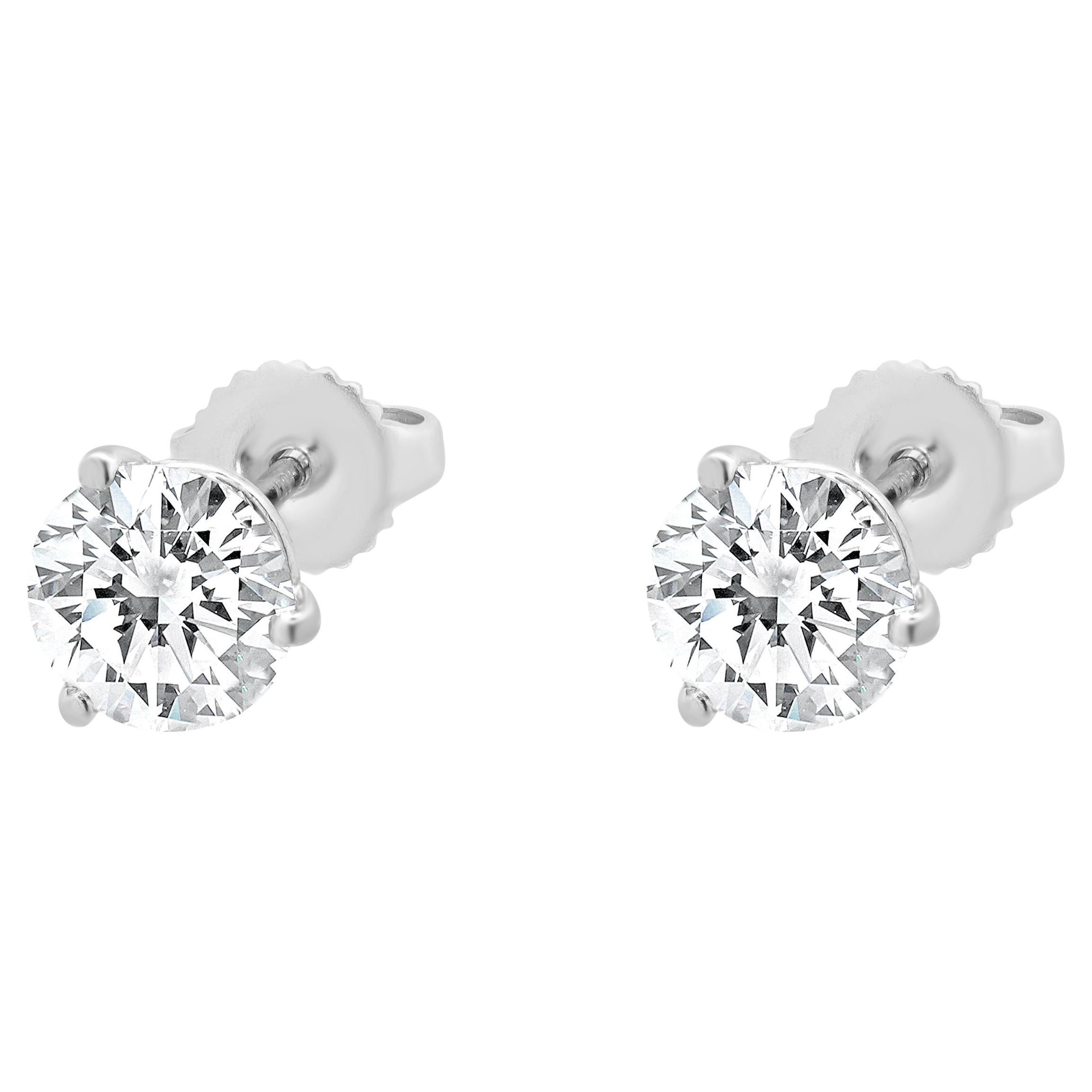 Clous d'oreilles en or blanc 14 carats avec diamants taille brillant rond