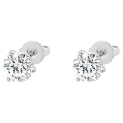 Clous d'oreilles en or blanc 14 carats avec diamants taille brillant rond