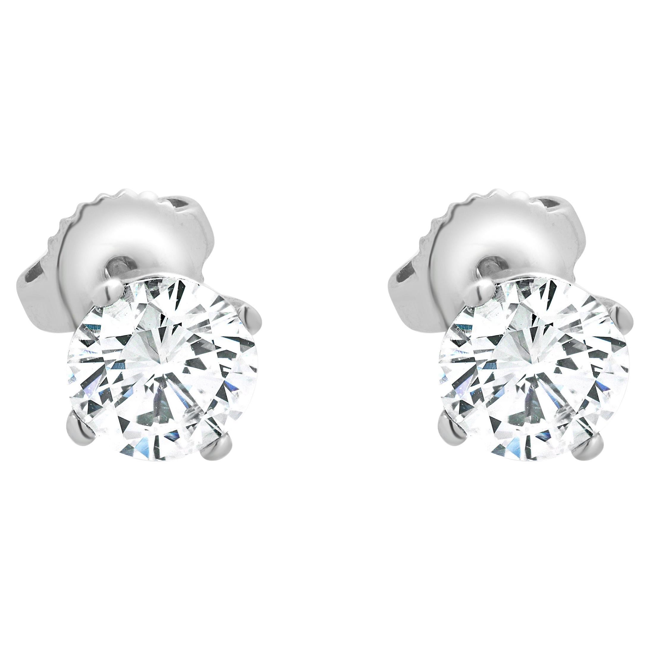 Clous d'oreilles en or blanc 14 carats avec diamants taille brillant rond