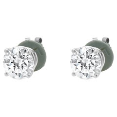 Clous d
oreilles en or blanc 14 carats avec diamants taille brillant rond