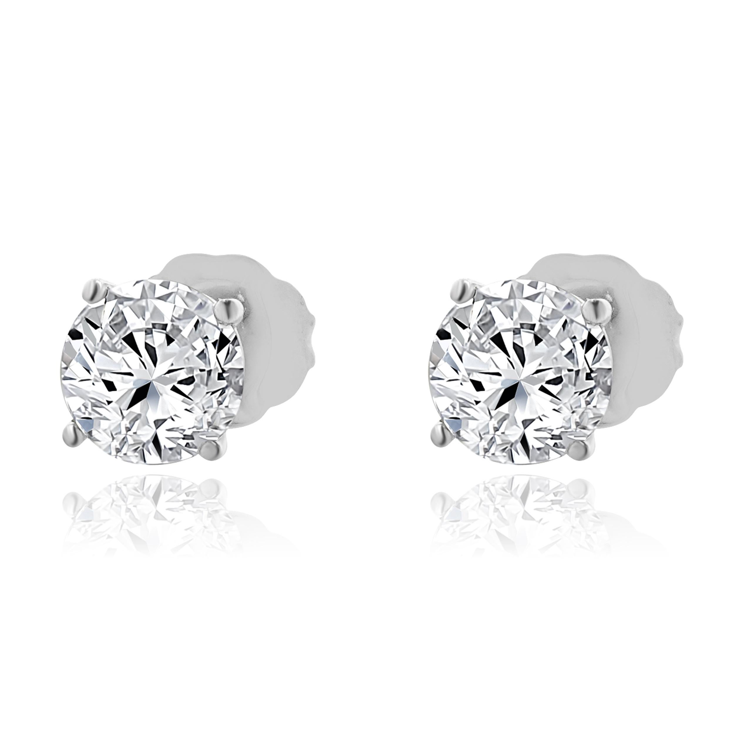 Clous d
oreilles en or blanc 14 carats avec diamants taille brillant rond