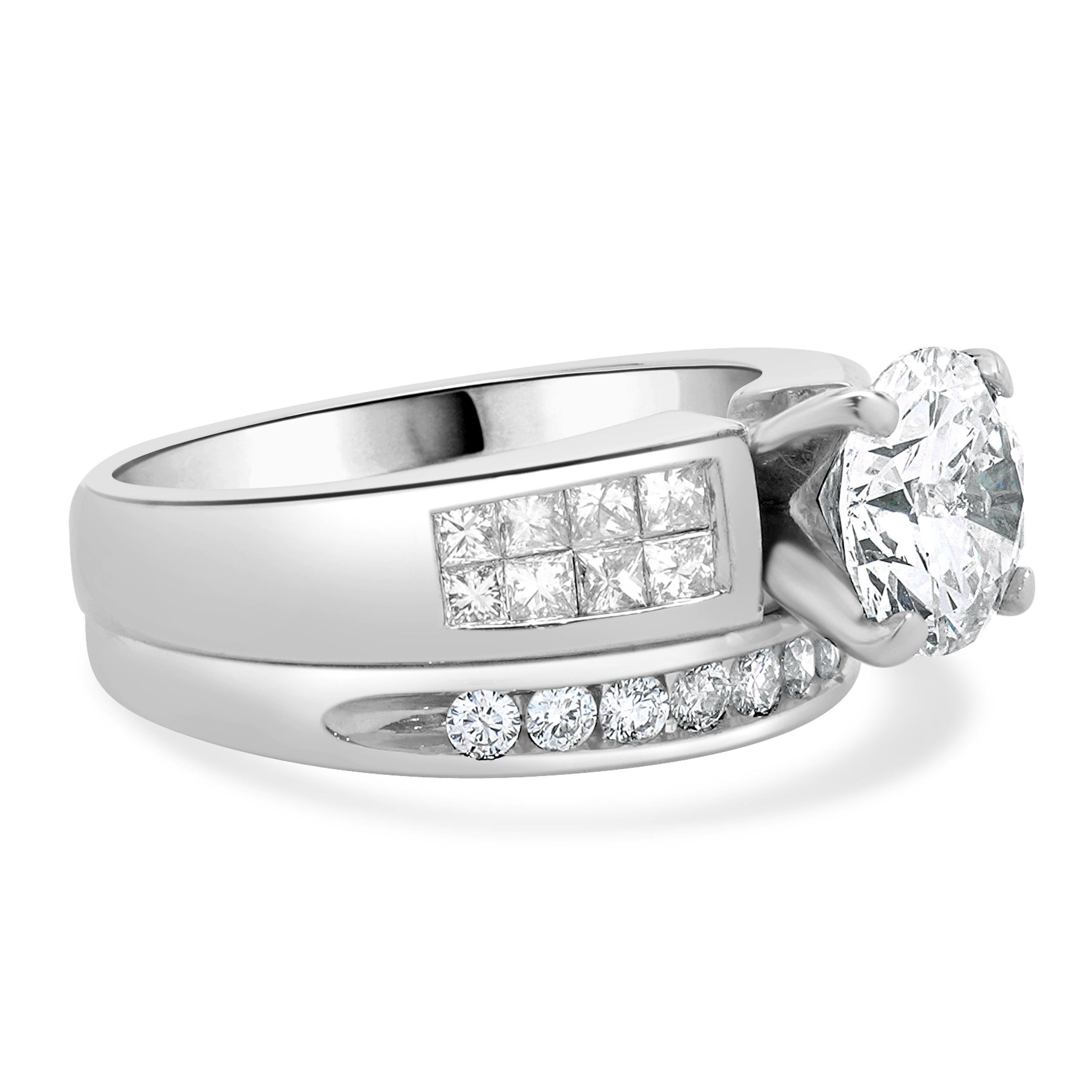 Designer: custom
Material: 14K white gold
Diamond: 1 round brilliant cut = 1.60ct
Color: H
Clarity: I1
Diamond: 10 round brilliant  & 16 princess cut = 0.68cttw
Color: H
Clarity: SI1-2
Dimensions: ring top measures 10mm wide
Ring Size: 6.5