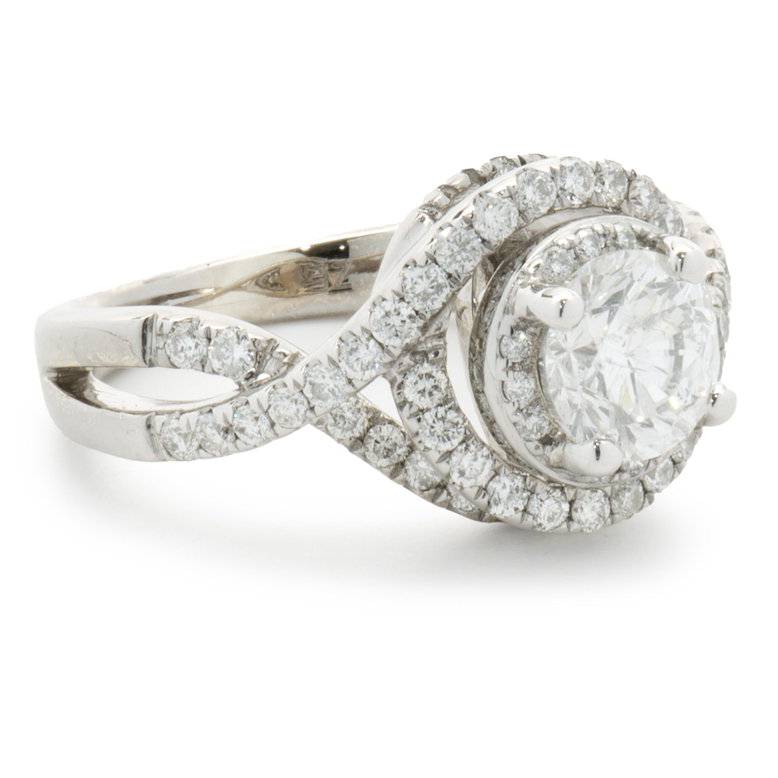 Designer: Custom
Material: 14K white gold
Diamond: 1 round brilliant cut = 0.77ct
Color: I
Clarity: I1
Diamond: 50 round brilliant cut = 0.50cttw
Color: H
Clarity: SI1
Dimensions: ring top measures 11mm wide
Ring Size: 5 (complimentary sizing