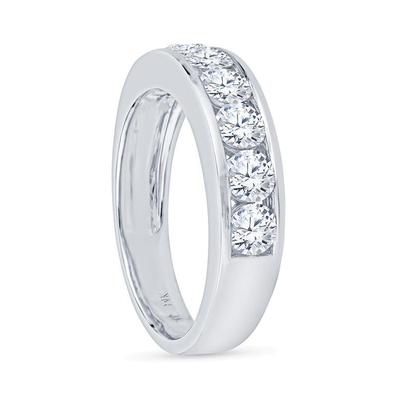 This exquisite band showcases 1.40 carats of round brilliant diamonds elegantly channel set in luxurious 14 karat white gold. Designed for the contemporary woman, it perfectly complements any occasion while ensuring a comfortable fit in size 7. This