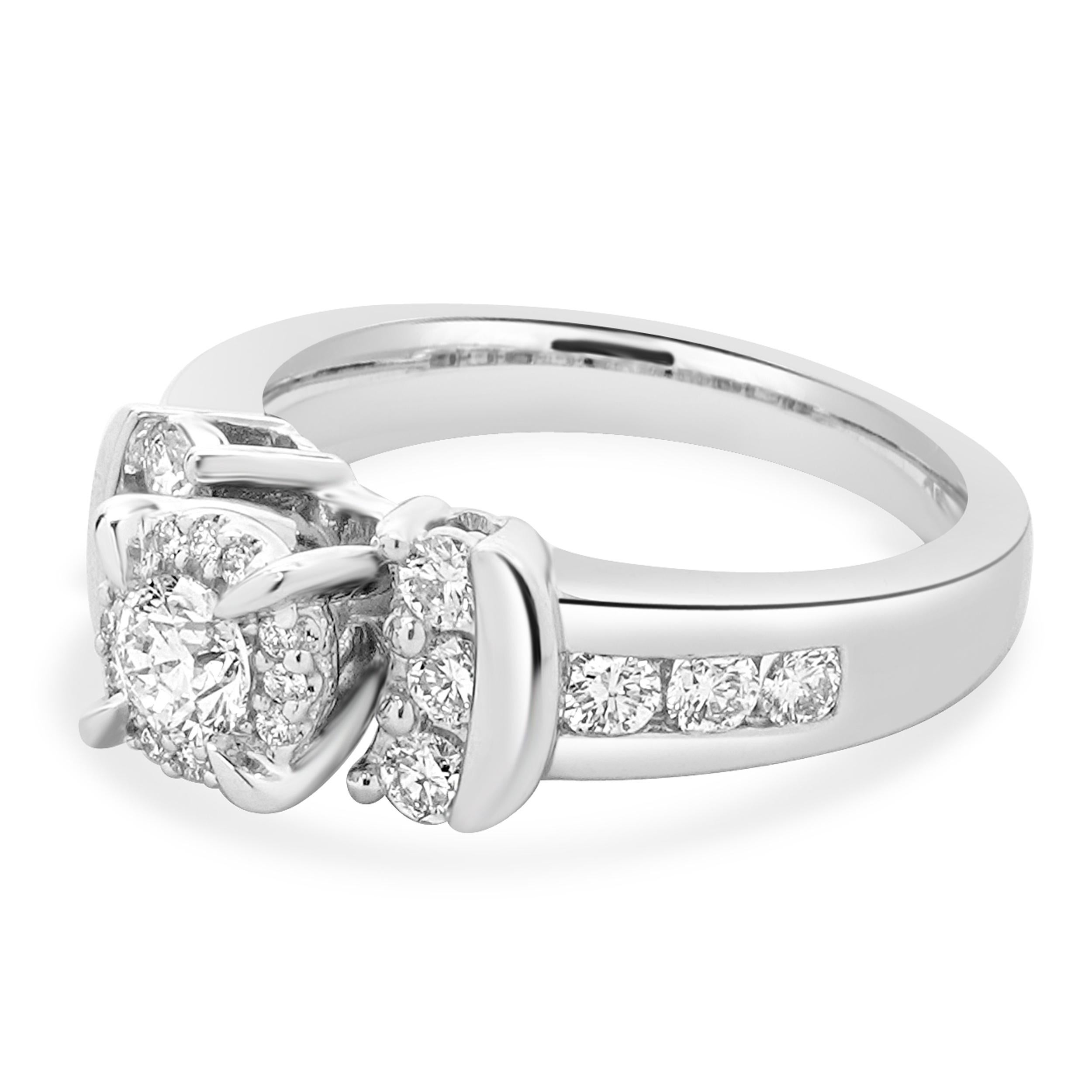 Designer: custom
Material: 14K white gold
Center Diamond: 0.25ct round 
Color: G
Clarity: SI2
Diamonds: 24 round cut= 0.60cttw
Color: G
Clarity: SI1
Ring Size: 7 (please allow two additional shipping days for sizing requests)
Dimensions: ring top