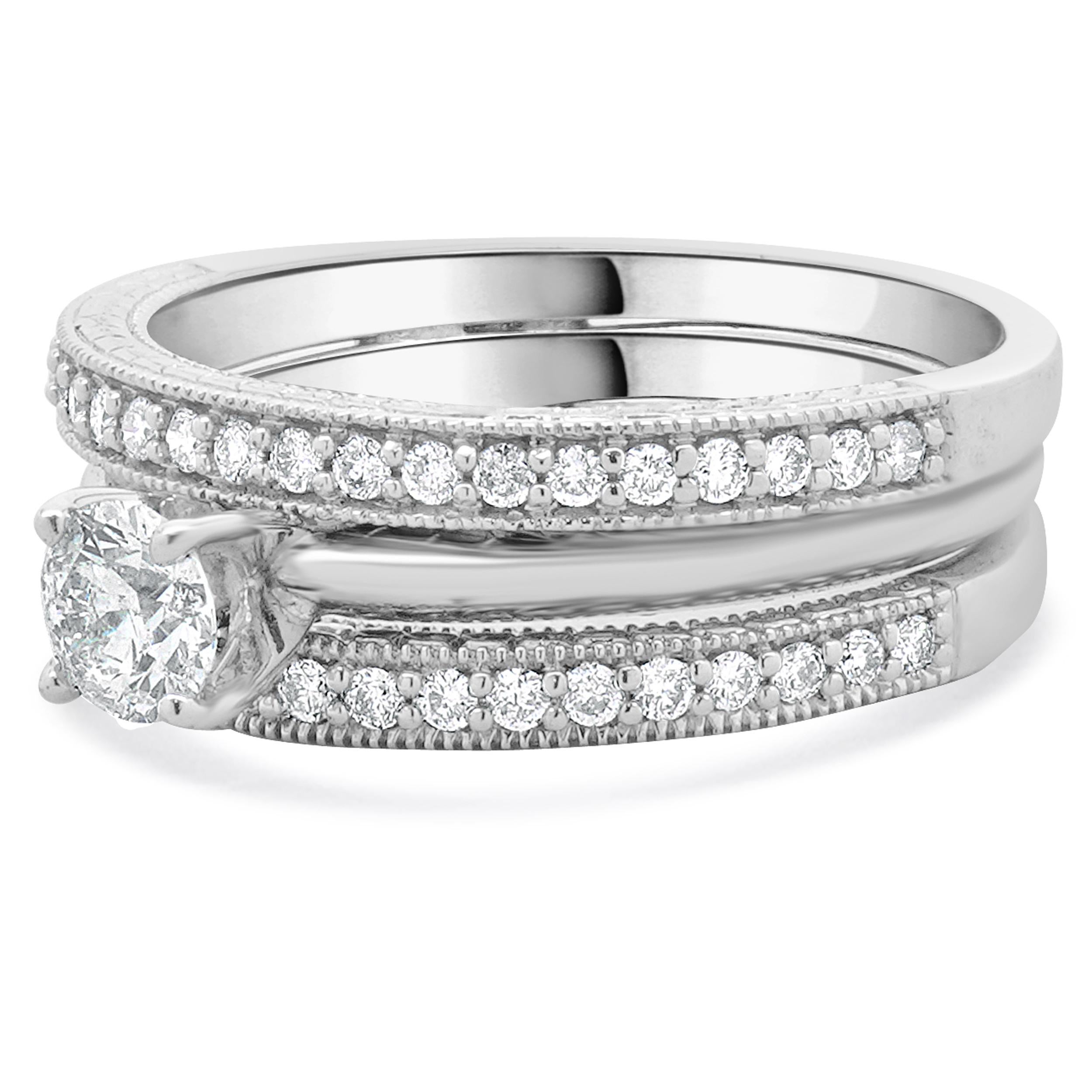 Designer: custom
Material: 14K white gold
Center Diamond: round brilliant cut = 0.49cttw
Color: G
Clarity: SI2
GSI: 8613900218
Diamonds: 42 round cut= 0.42cttw
Color: G
Clarity: SI2
Ring Size: 9 (please allow two additional shipping days for sizing