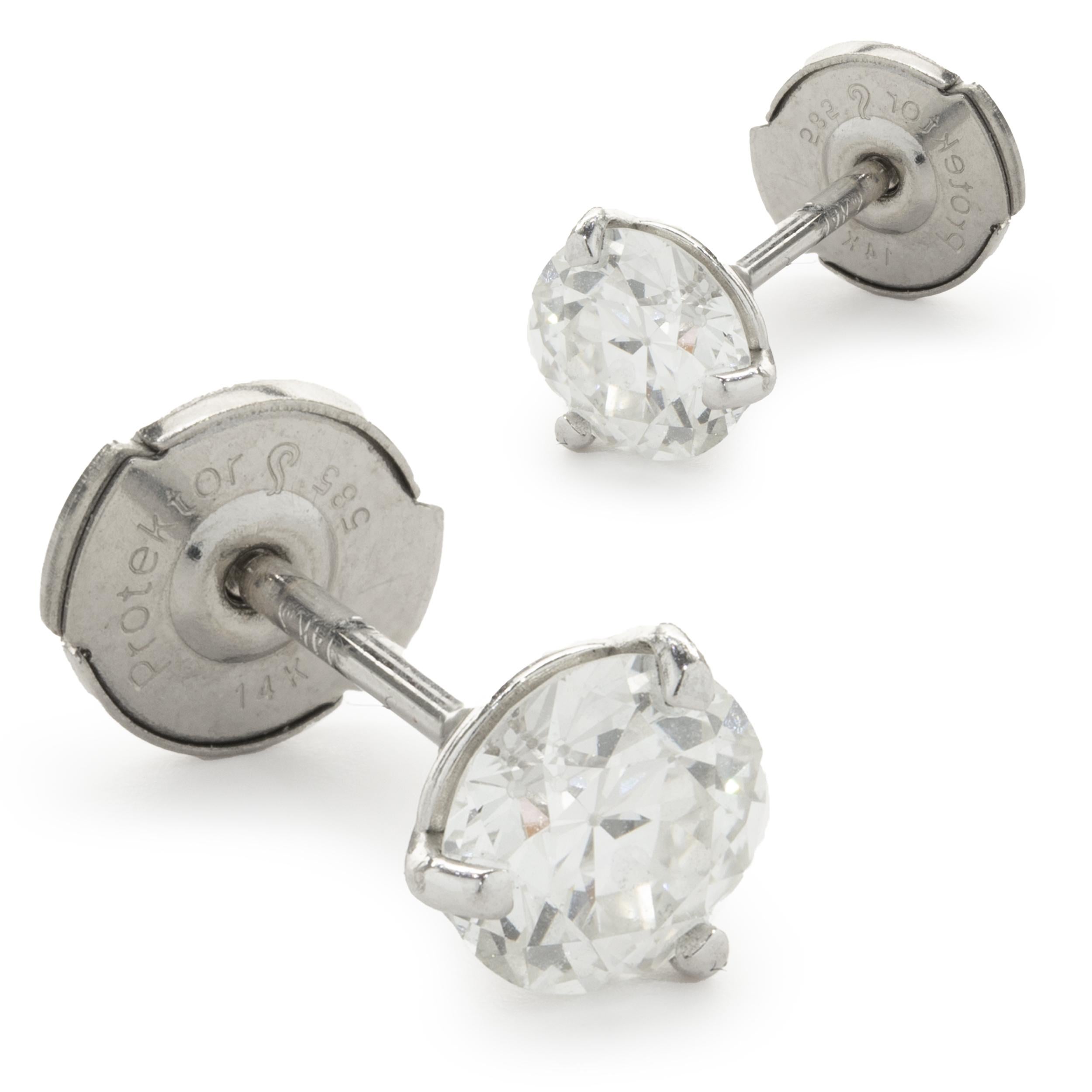 Material: 14k white gold
Diamond: 2 round European cut = 0.90cttw 
Color: I / J
Clarity: I1
Dimensions: earrings measure approximately 5.98mm in diameter
Fastenings: post with la pousette backs
Weight: 1.08 grams
