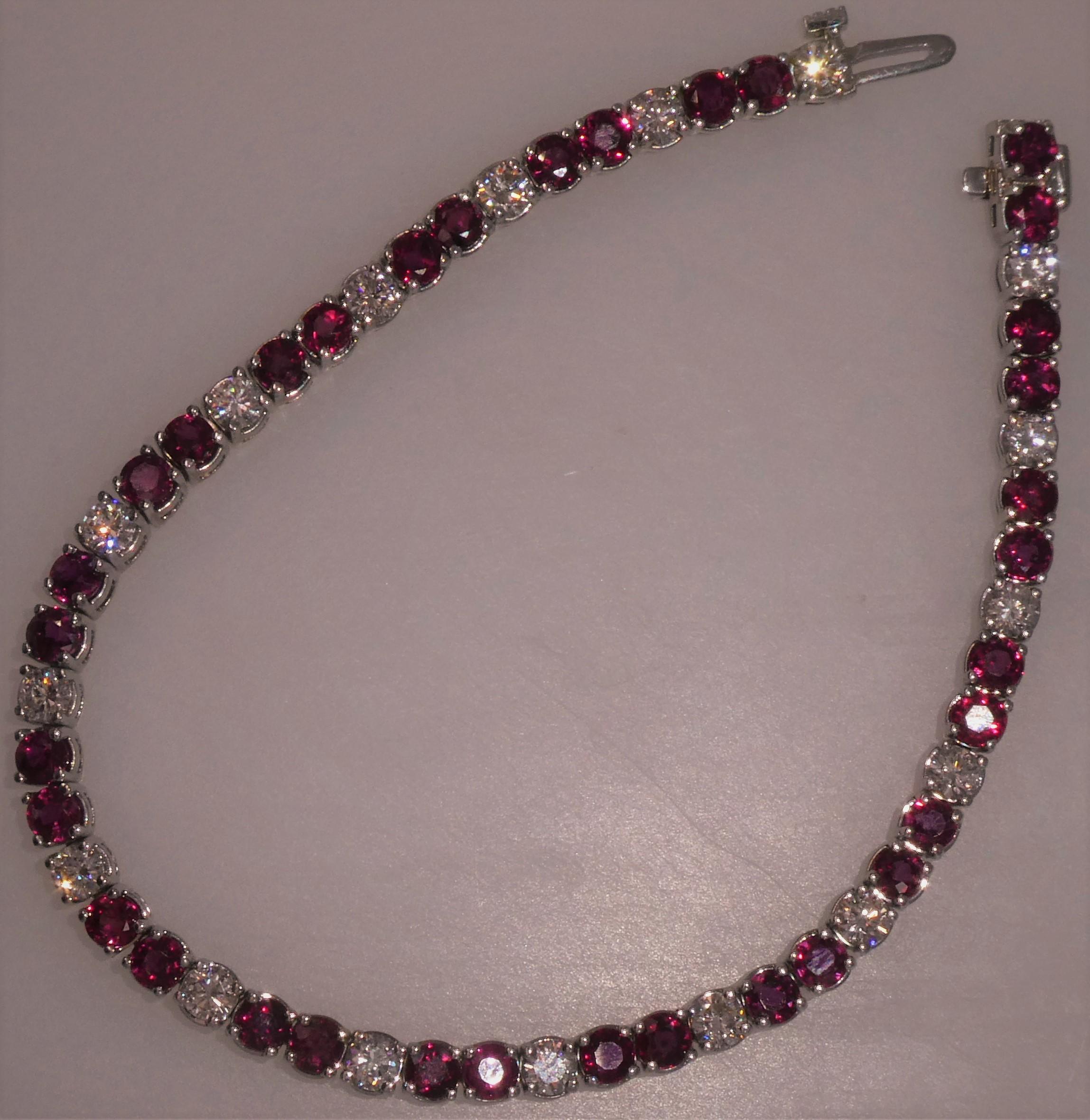 Mounted in 14 Karat White Gold and using very fine Rubies, this bracelet is lively and easy to wear.  Much in the 