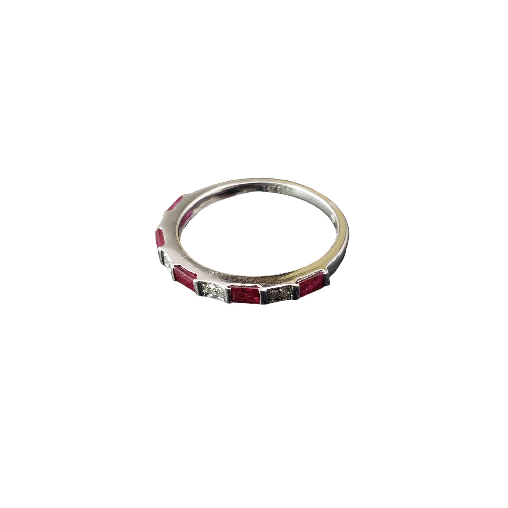 14 Karat White Gold Ruby and Diamond Band Ring Size 6.25 JAGi Certified-

This elegant band features five baguette cut natural rubies and eight round single cut diamonds set in classic 14K white gold. 

Width: 2 mm.  Shank: 1.5 mm.

Total ruby
