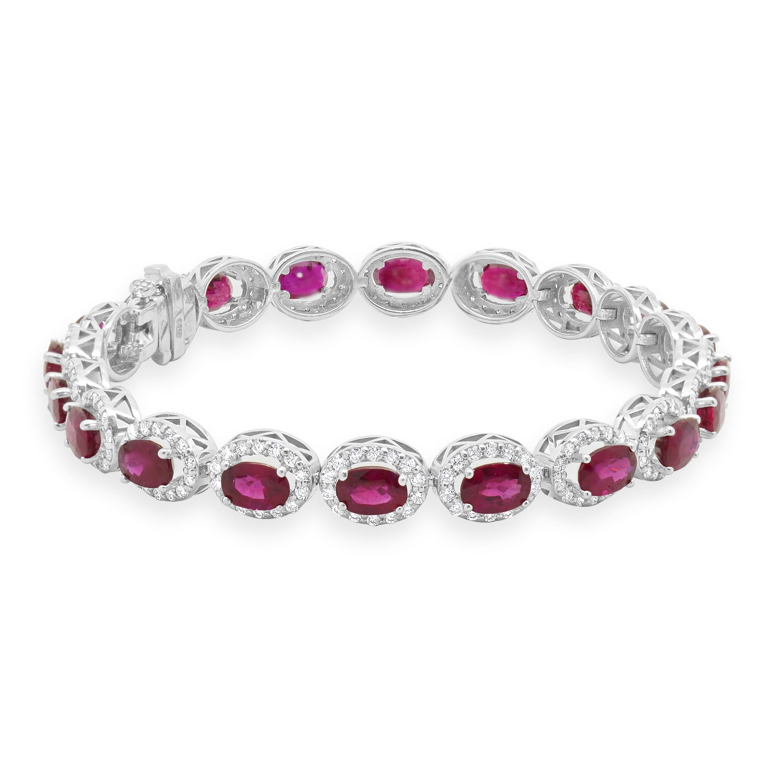 Designer: custom
Material: 14K white gold
Diamond: 260 round brilliant cut = 2.38cttw
Color: G
Clarity: SI1
Ruby: 20 oval cut = 11.44cttw
Weight: 14.94 grams
Dimensions: bracelet will fit up to a 7-inch wrist
