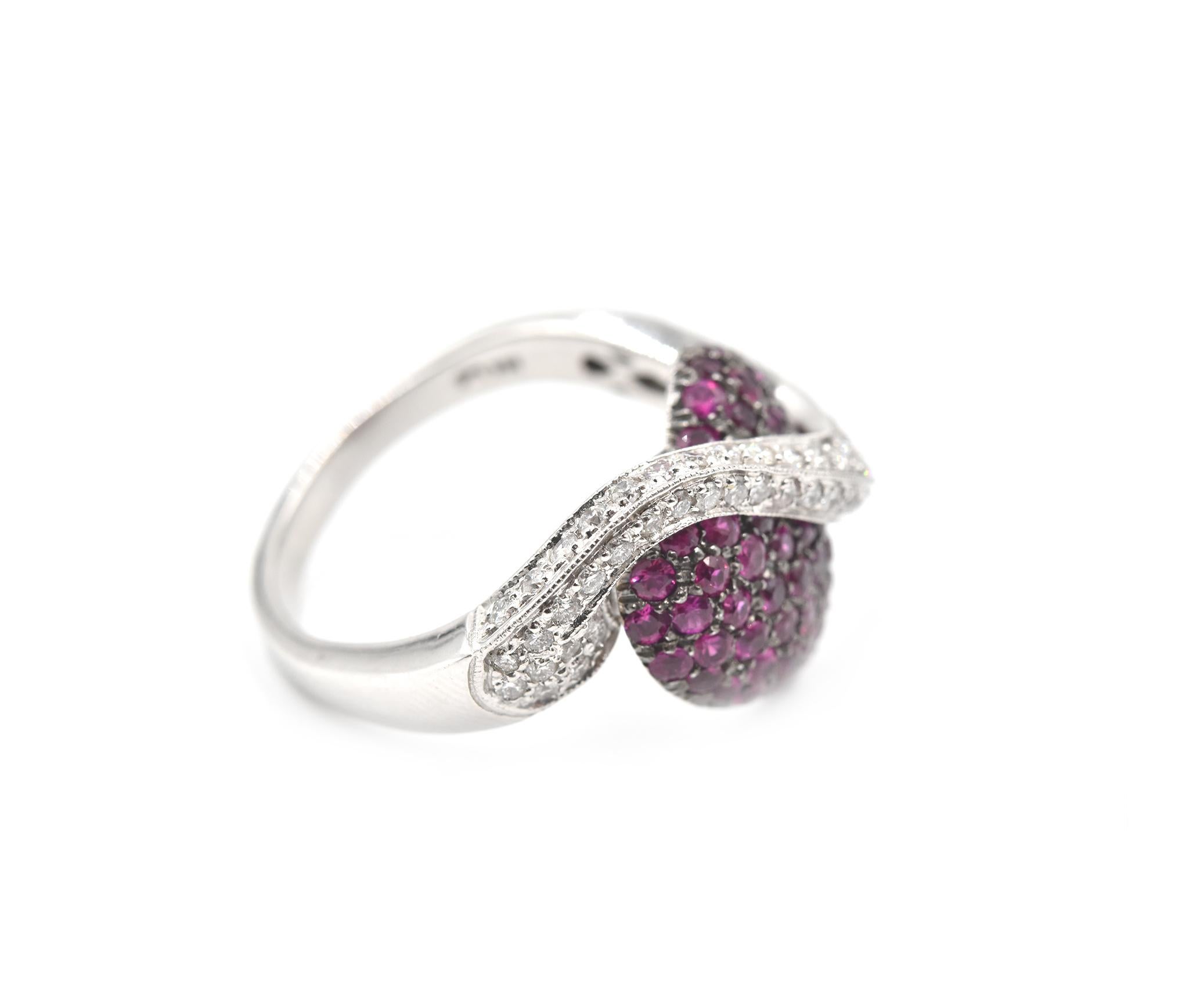 Designer: custom design
Material: 14k white gold
Ruby: 52 round ruby = 1.56cttw
Diamonds: 61 round brilliant cut = 1.00cttw
Color: G/H
Clarity: SI1		
Dimensions: 14.64mm length 
Ring Size: 10 (please allow two additional shipping days for sizing