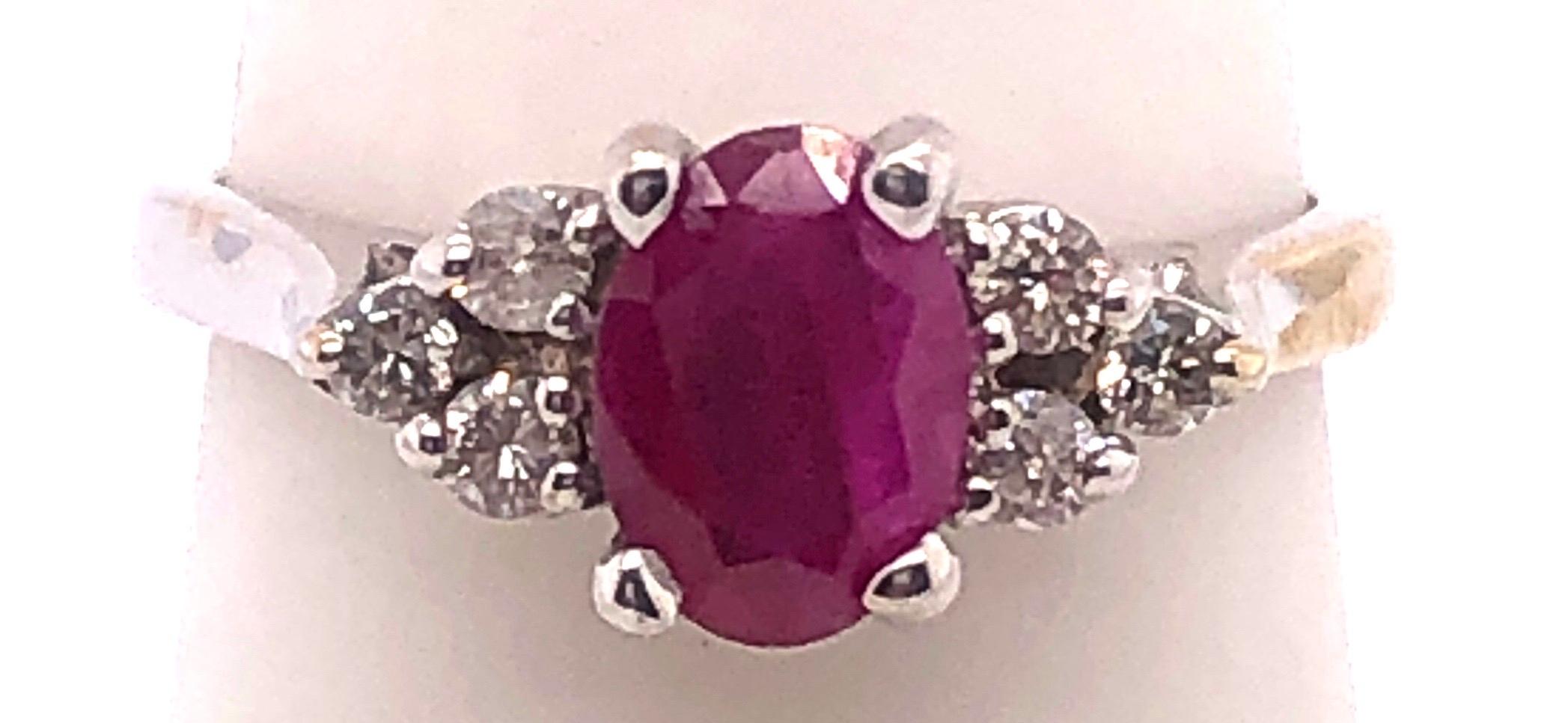 Oval Cut 14 Karat White Gold Ruby Solitaire Ring with Diamond Accents For Sale