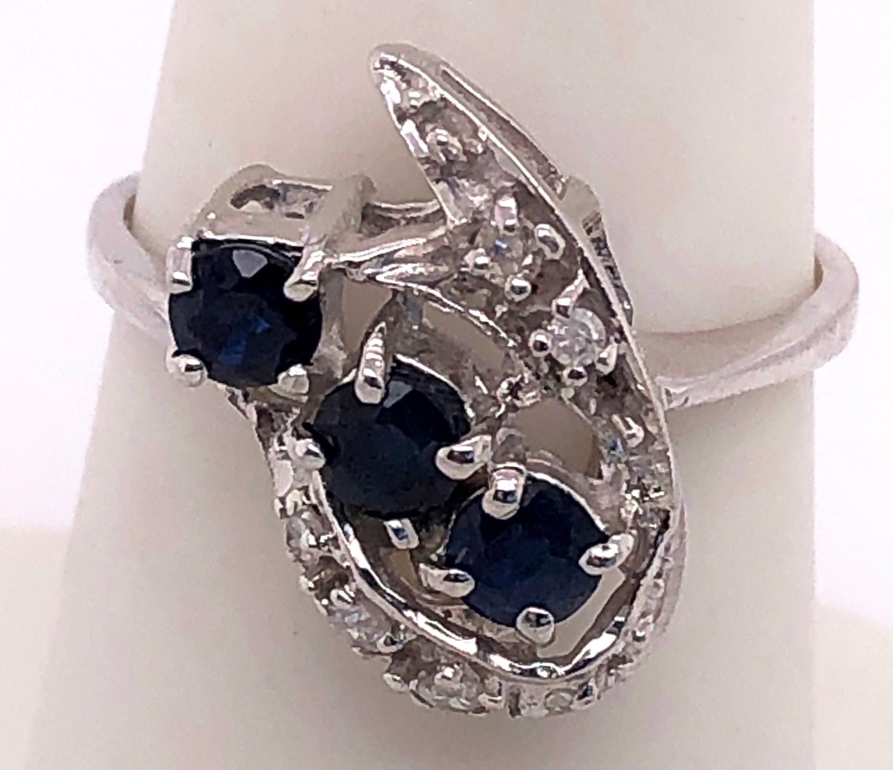 14 Karat White Gold Contemporary Ring with Sapphires and Diamonds.
0.25 total diamond weight.
3 grams total weight.
Size 7