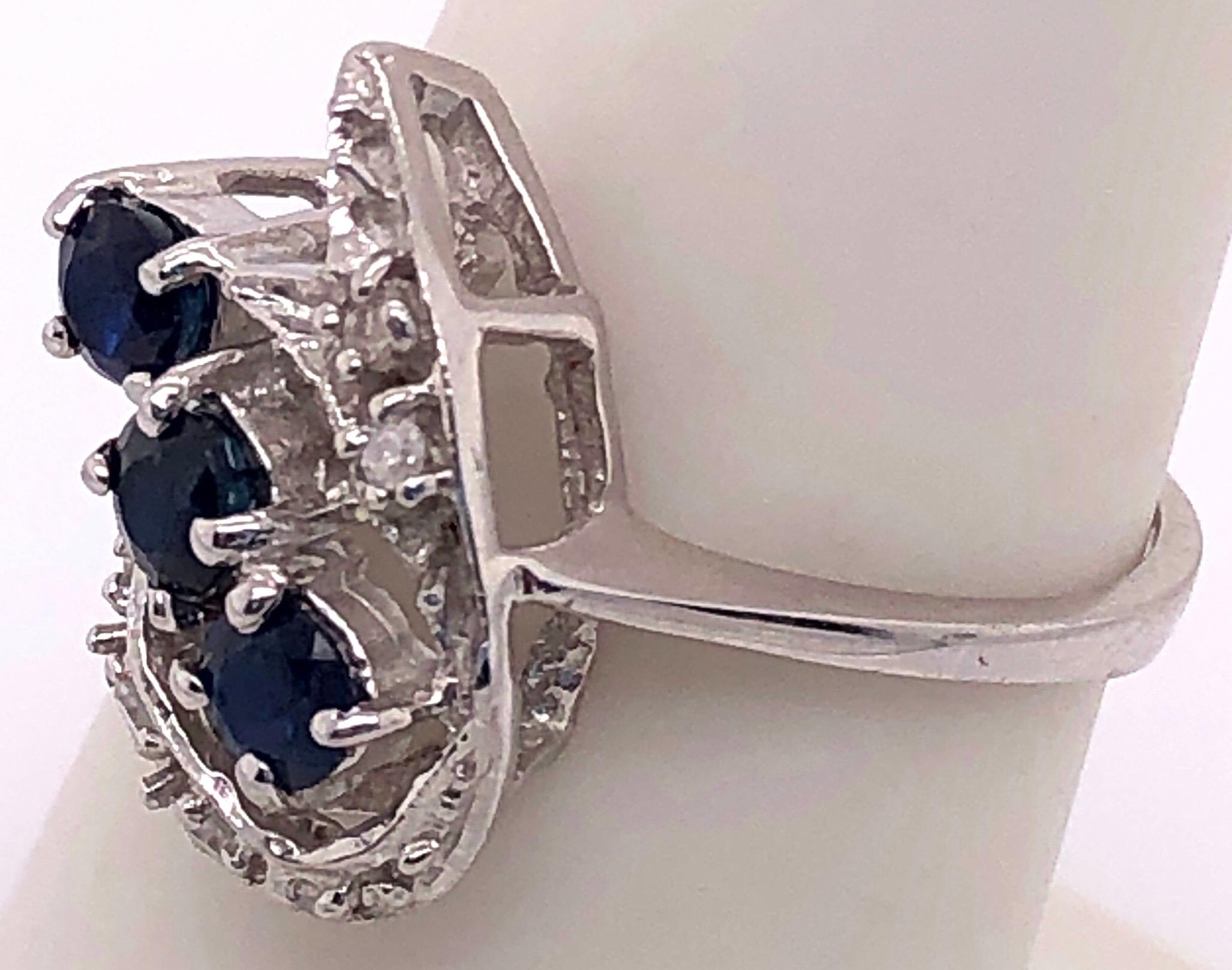 Round Cut 14 Karat White Gold Sapphire and Diamond Contemporary Ring For Sale