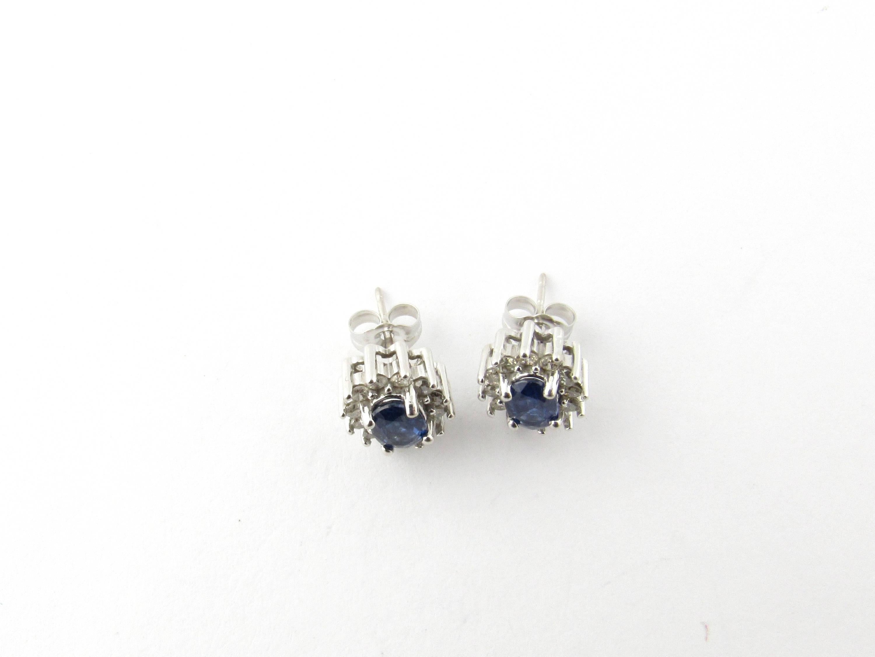 Vintage 14 Karat White Gold Sapphire and Diamond Earrings-

These exquisite earrings each feature a genuine oval sapphire (6 mm x 4 mm) surrounded by 12 round brilliant cut diamonds (.02 ct. each) and set in 14K white gold. Push back