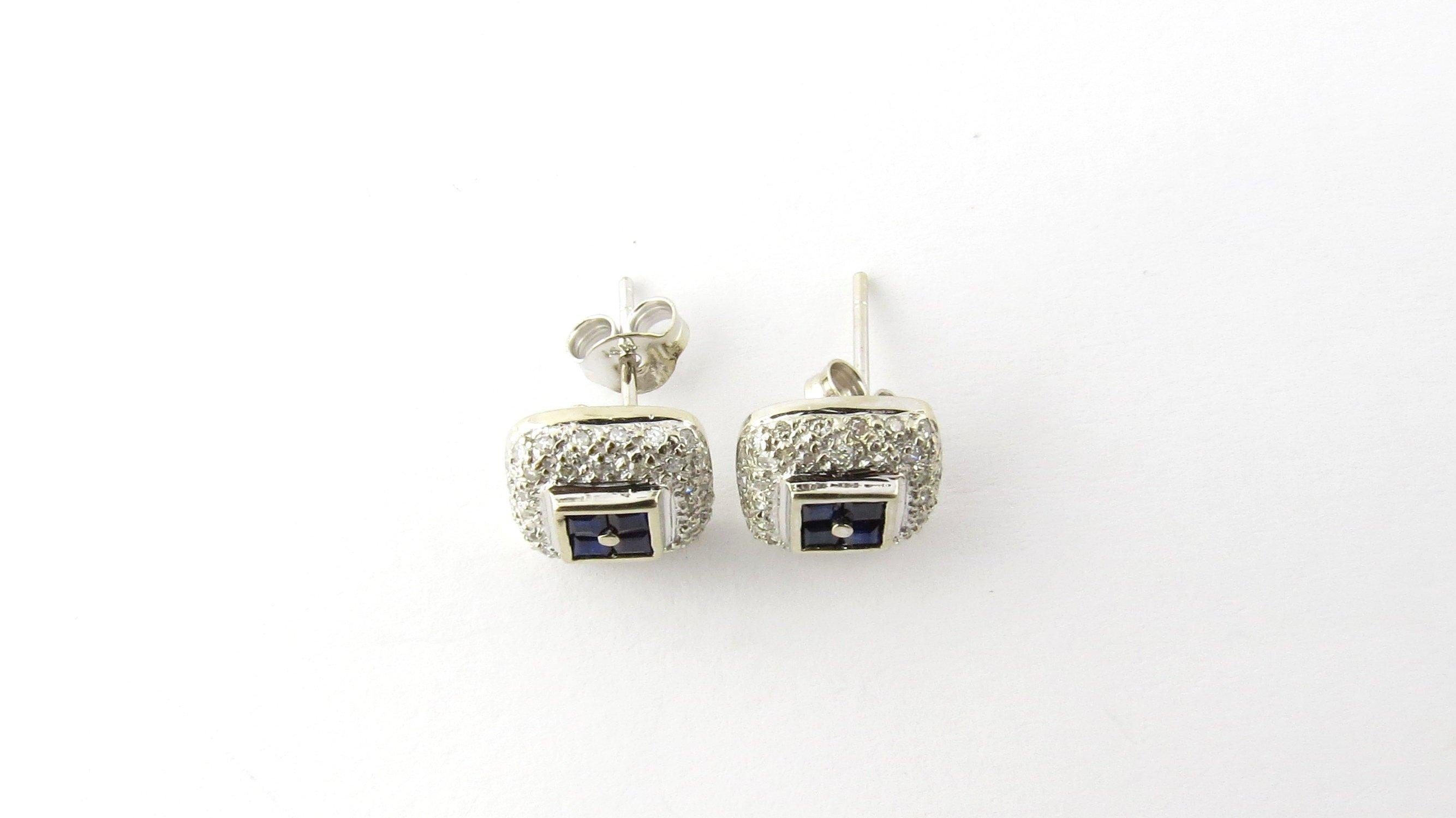 Vintage 14 Karat White Gold Sapphire and Diamond Earrings-

These sparkling earrings each feature four princess cut genuine sapphires surrounded by 36 round single-cut diamonds. Beautifully detailed in 14K white gold. Push back