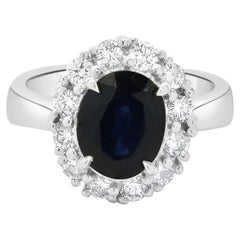 14 Karat White Gold Sapphire and Diamond Halo Ring