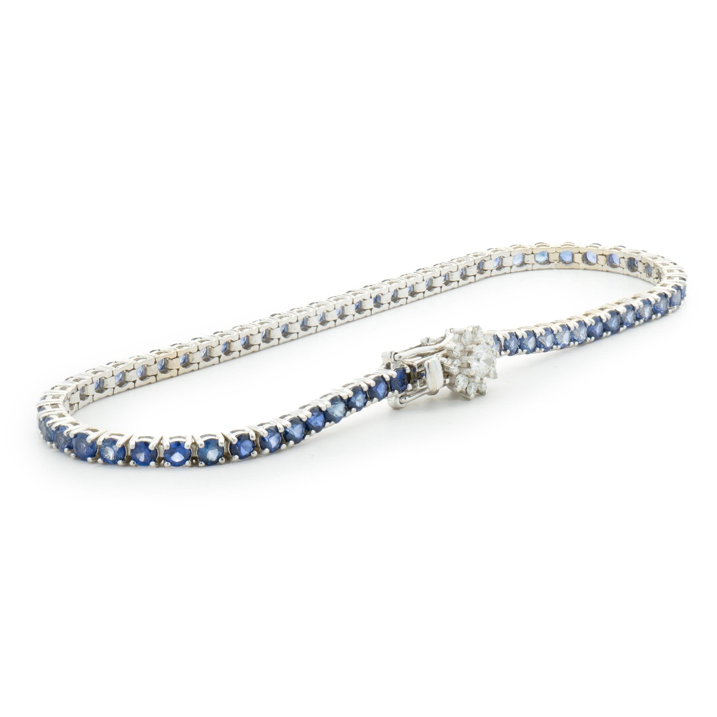 Designer: custom
Material: 14K white gold
Diamond: 11 round brilliant cut = 0.40cttw
Color: H
Clarity: SI1-2
Sapphire: 63 round cut = 5.04cttw
Weight: 7.94 grams
Dimensions: bracelet will fit up to a 7-inch wrist

