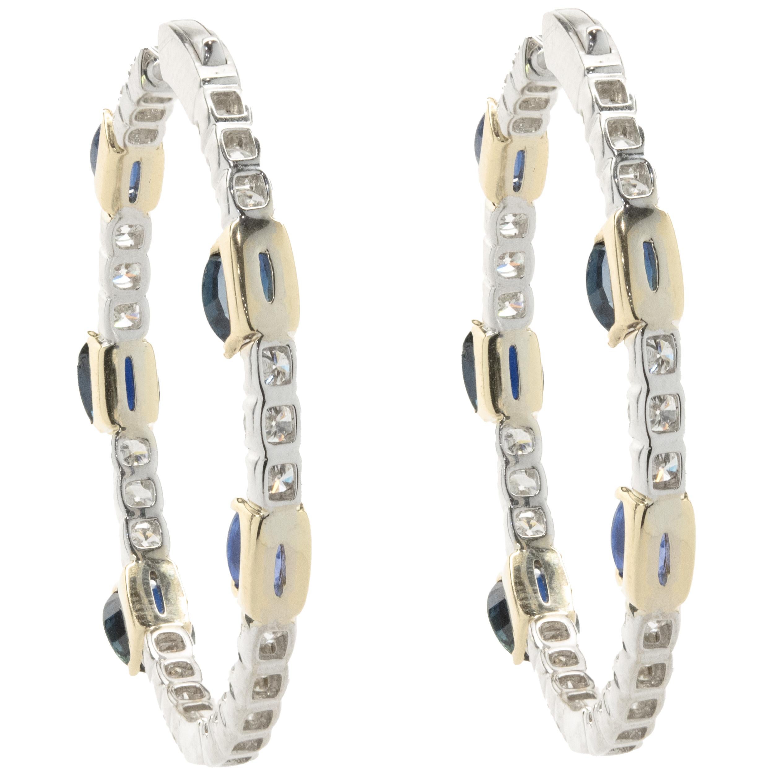 Designer: custom
Material: 14K white gold
Diamond: 48 round brilliant cut = 3.84cttw
Color: H
Clarity: SI1
Sapphire: 10 oval cut = 9.07cttw
Dimensions: earrings measure 44mm
Fastenings: posts with snap backs
Weight: 14.85 grams
