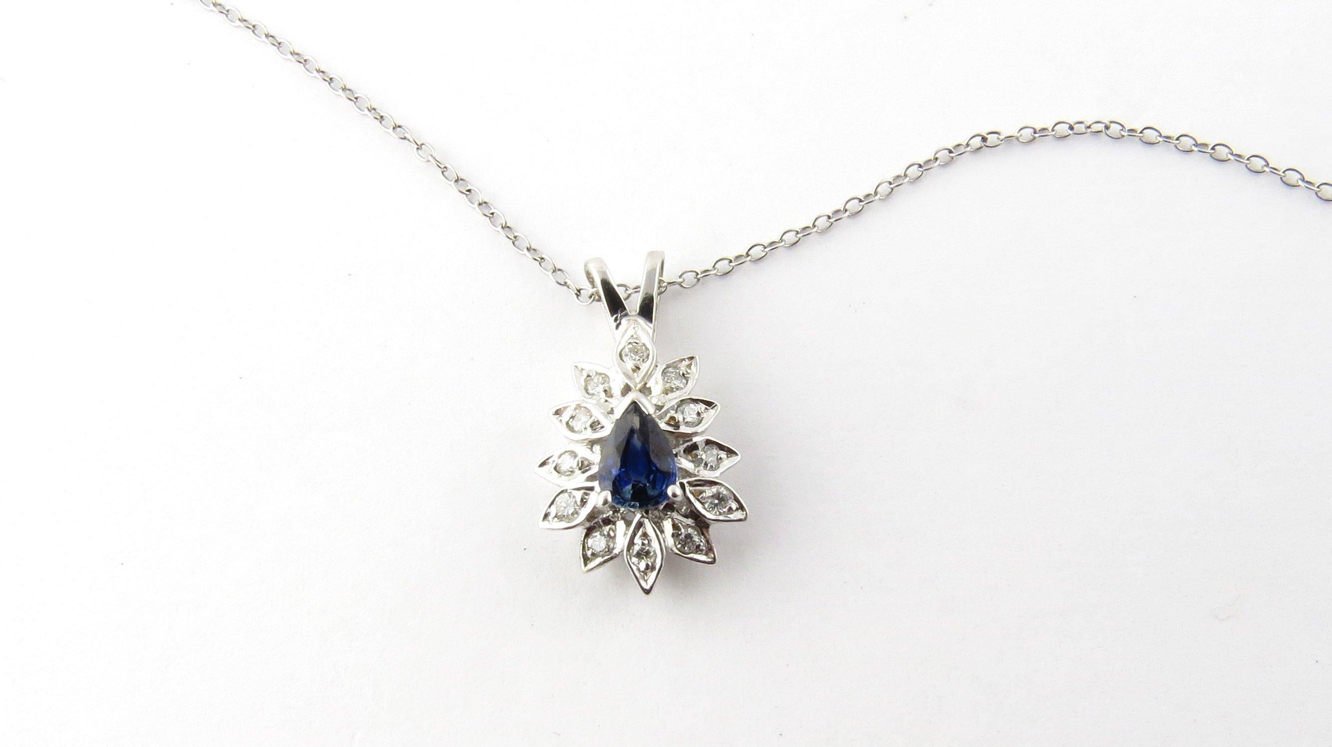 Vintage 14 Karat White Gold Sapphire and Diamond Pendant Necklace-

This lovely pendant features a pear-shaped sapphire (6 mm x 4 mm) surrounded by 12 round brilliant cut diamonds suspended from a classic 18 inch 14K white gold