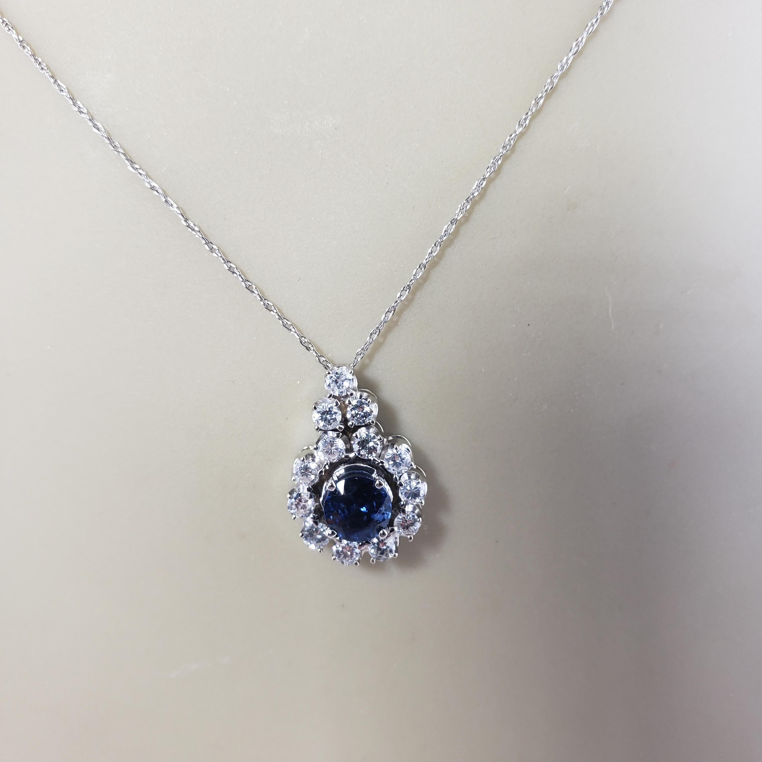 Vintage 14 Karat White Gold Sapphire and Diamond Pendant Necklace-

This lovely pendant features one round sapphire (5 mm) surrounded by 13 round brilliant cut diamonds. Suspends from a classic cable necklace.

Approximate total diamond weight: .52