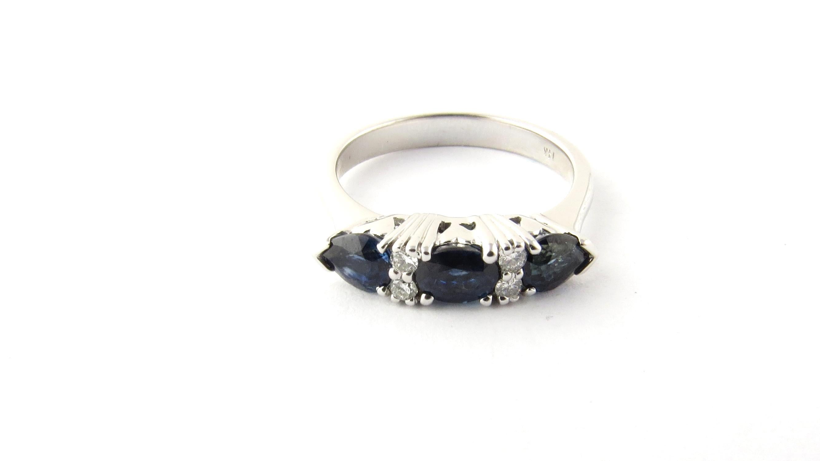 Vintage 14 Karat White Gold Sapphire and Diamond Ring Size 6.5.

This stunning ring features three genuine sapphires (one oval, two pear) accented with four round brilliant cut diamonds set in classic 14K white gold.

Approximate total diamond
