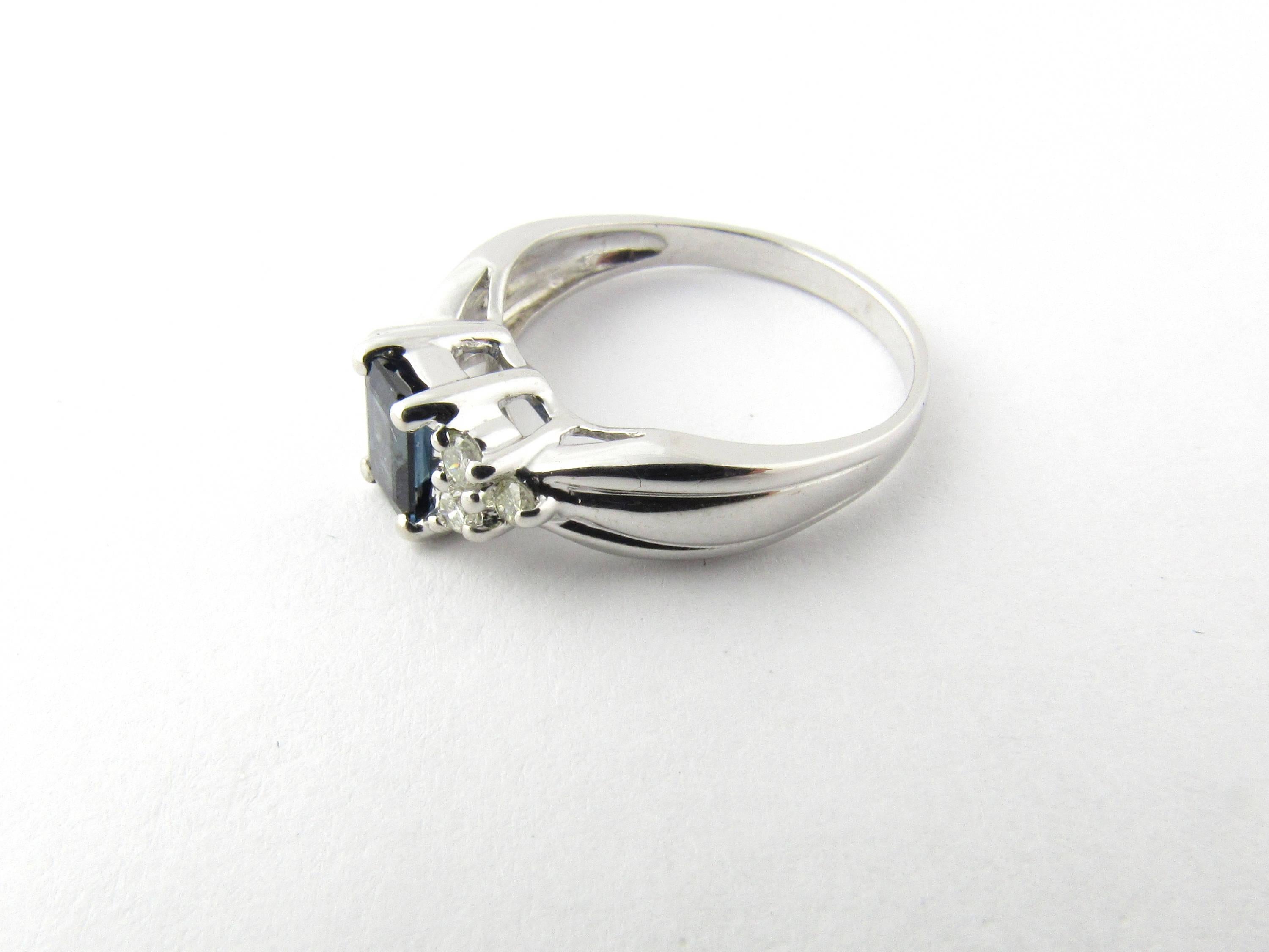 Vintage 14 Karat White Gold Sapphire and Diamond Ring Size 4.75- 
This lovely ring features one emerald cut sapphire (6 mm x 4 mm) accented with six round brilliant cut diamonds and set in classic 14K white gold. Shank 2 mm. 
Approximate total