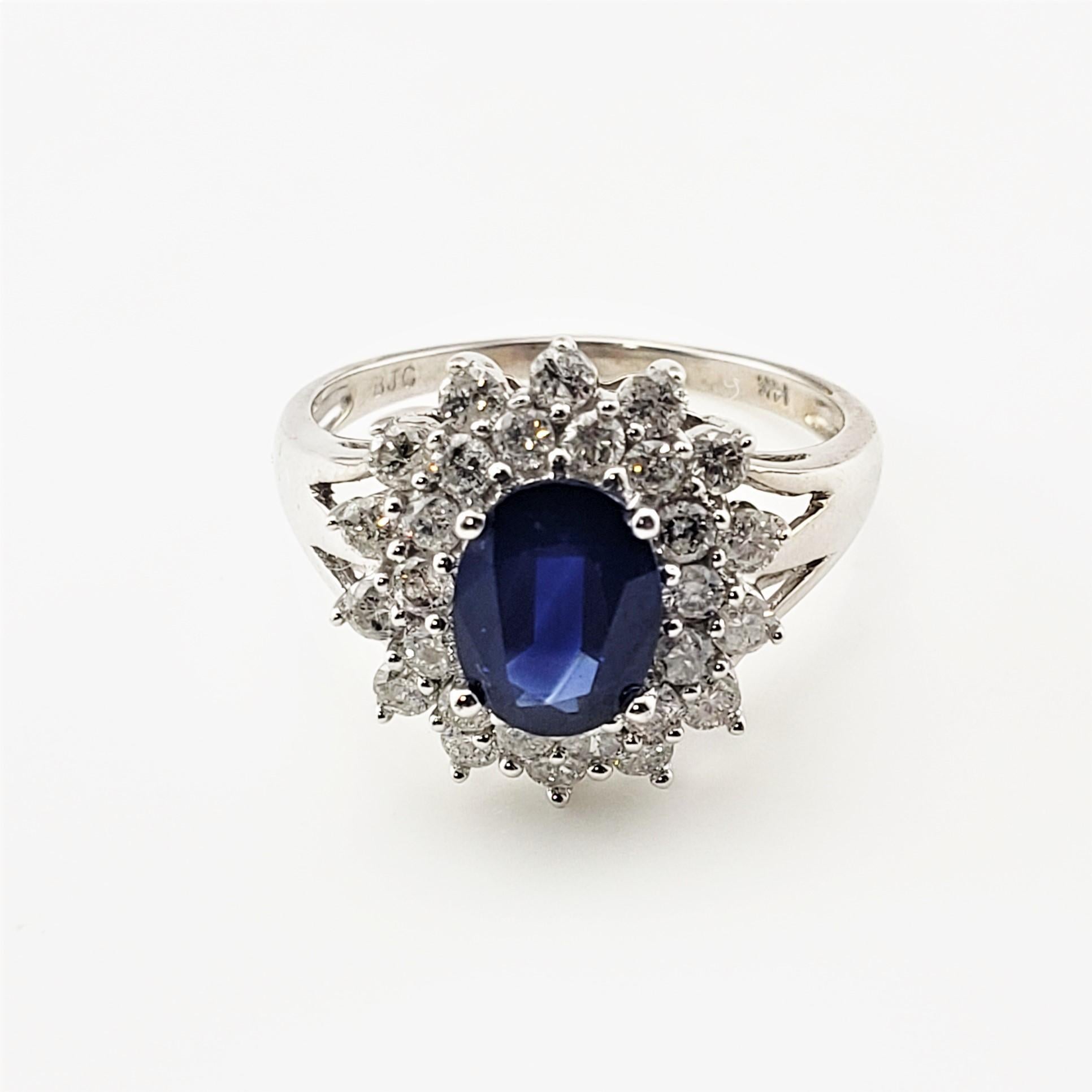 14 Karat White Gold Sapphire and Diamond Ring Size 7.25 GAI Certified-

This spectacular ring features one oval cut sapphire (8 mm x 6 mm) and 28 round brilliant cut diamond set in classic 14K white gold.
Top of ring measures 15 mm x 14 mm.  Shank
