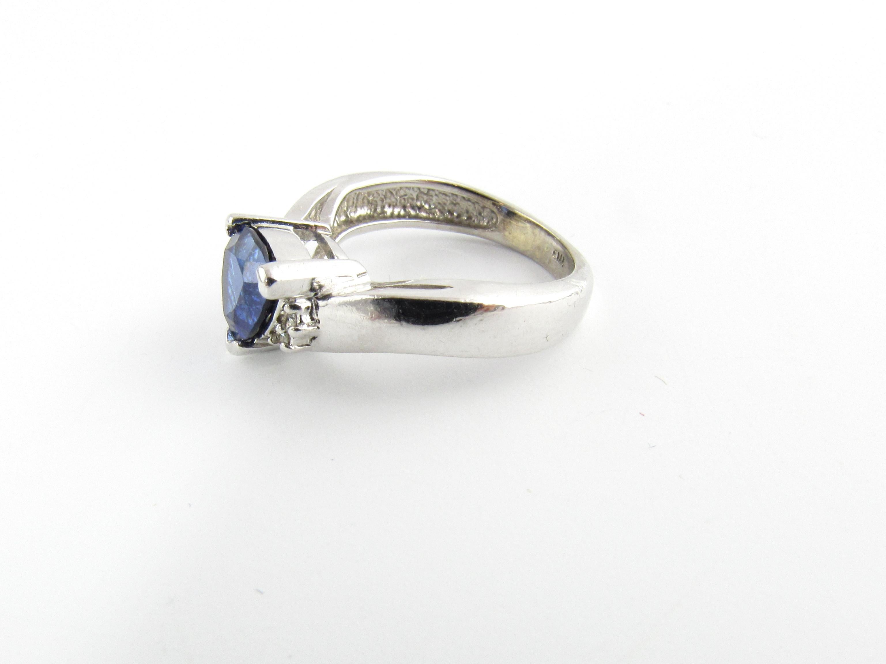 Vintage 14 Karat White Gold Sapphire and Diamond Ring Size 4.5-

This lovely ring features one triangular sapphire (8 mm x 8 mm) and four round brilliant cut diamonds set in polished 14K white gold.  Shank measures 2.5 mm.

Comes with Gemological