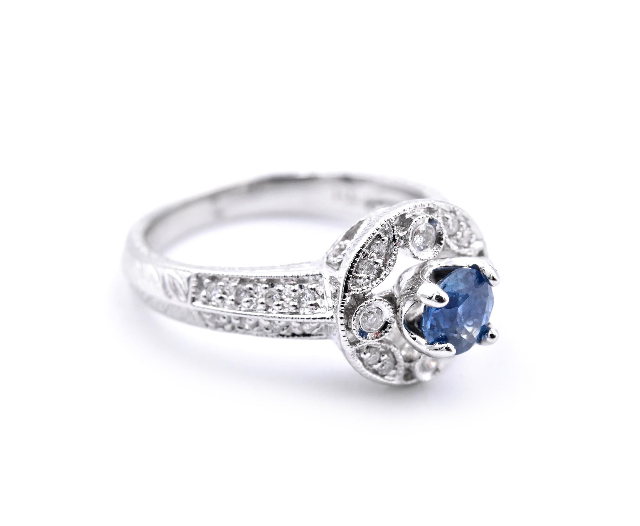 Designer: custom design
Material: 14k white gold
Gemstones: Sapphire = .70ct Oval
Certification: AGI 25324
Diamonds: 42 round brilliant cuts = .52cttw
Color: F
Clarity: VS2-SI
Ring Size: 7.5 (please allow two additional shipping days for sizing