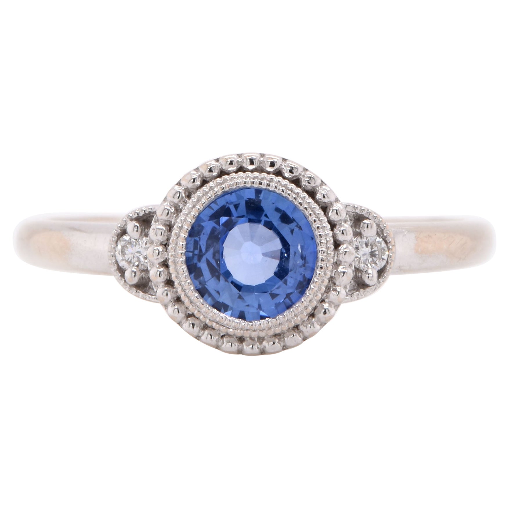 Anello con zaffiro e diamante in oro bianco 14 carati