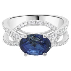 Anello con zaffiro e diamante in oro bianco 14 carati
