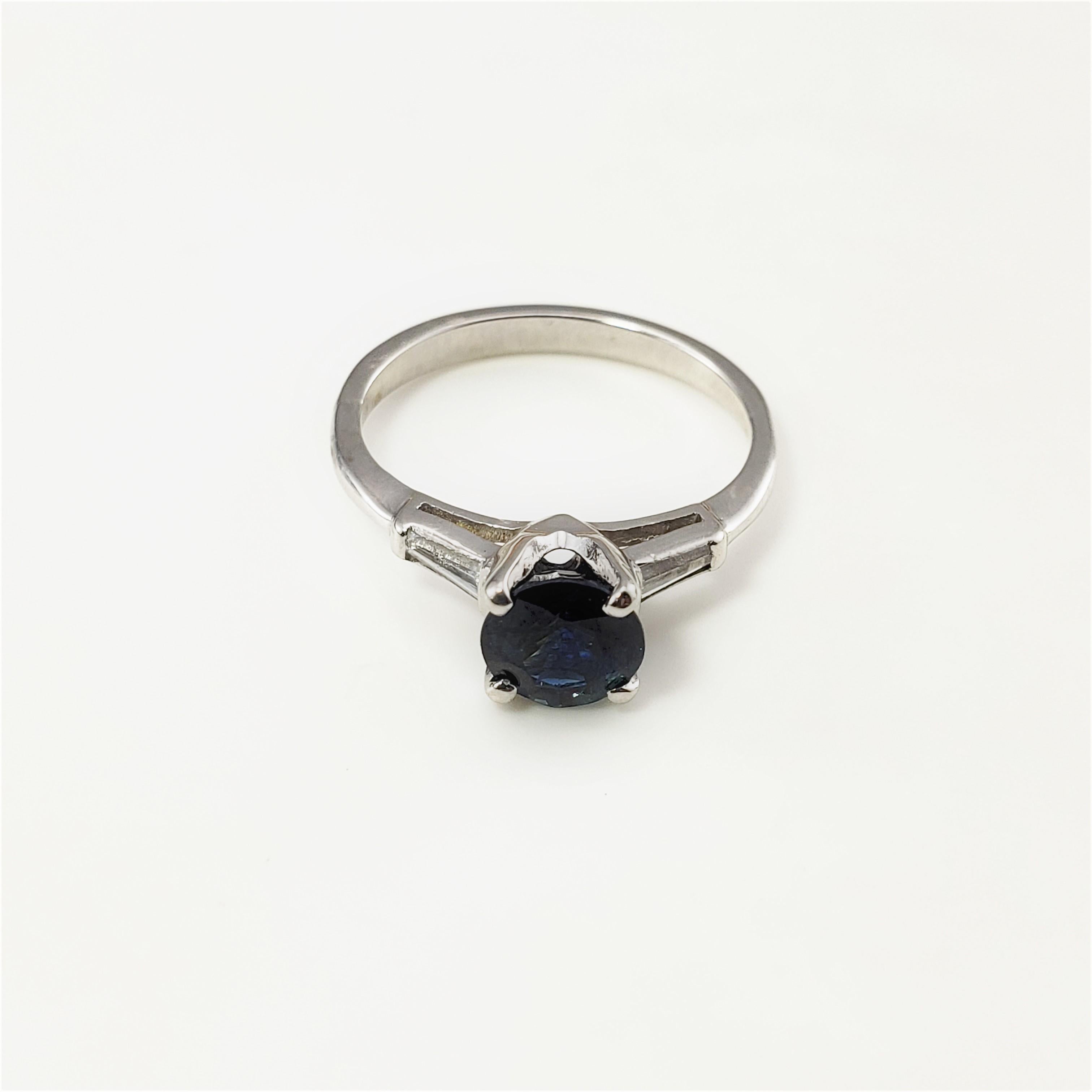 14 Karat White Gold Sapphire and Diamond Ring Size 6.5 GAI Certified-

This lovely ring features one round sapphire (6 mm) and two baguette diamond set in classic 14K white gold.  Shank: 2 mm.

Sapphire weight:  1.31 ct.

Total diamond weight:  .08