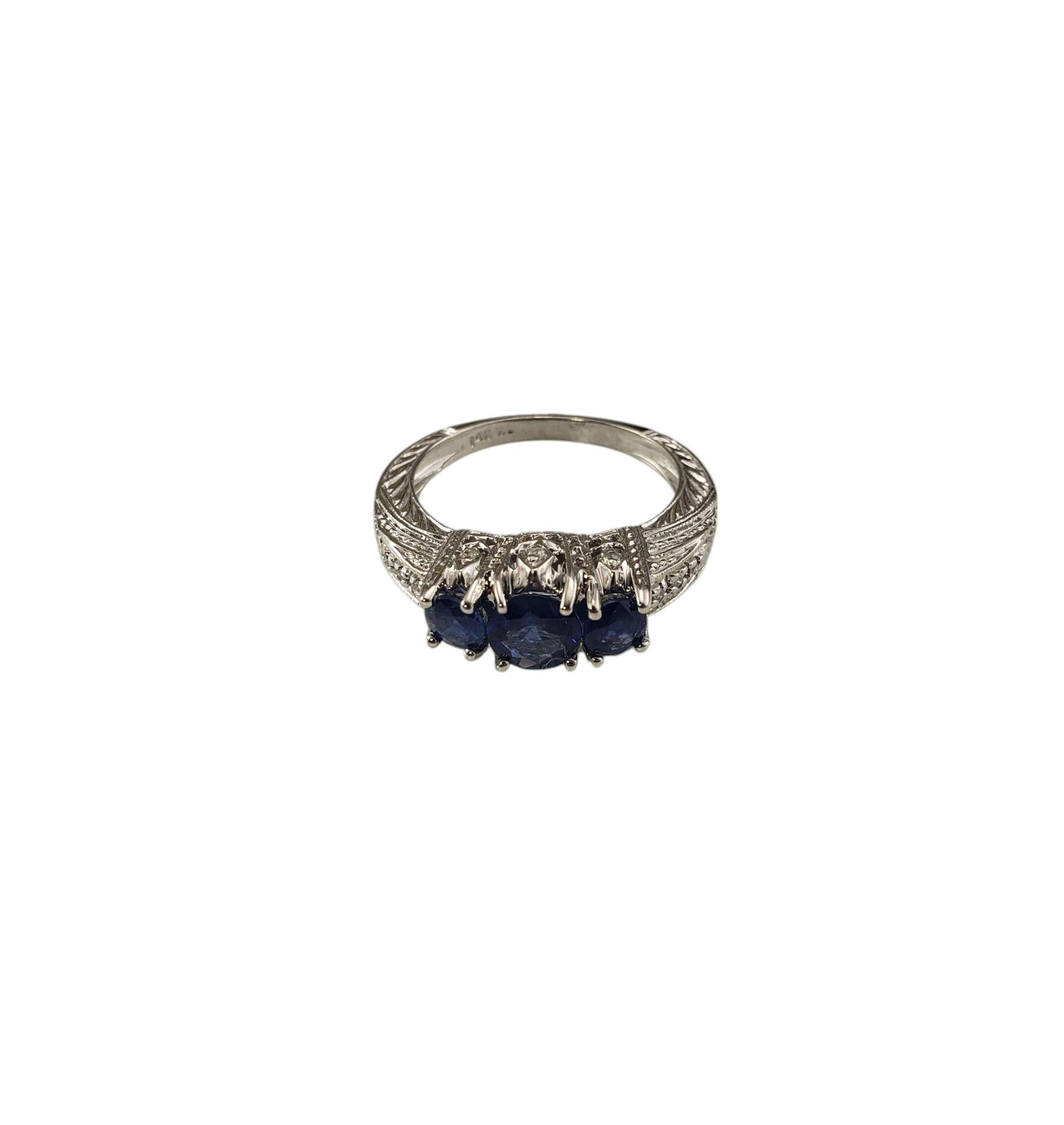 14 Karat White Gold Sapphire and Diamond Ring Size 8 JAGi Certified

This elegant ring features three round cut natural blue sapphires and 12 round brilliant cut diamonds set in beautifully detailed 14K white gold.

Width: 8 mm.
Shank: 2 mm.

Front