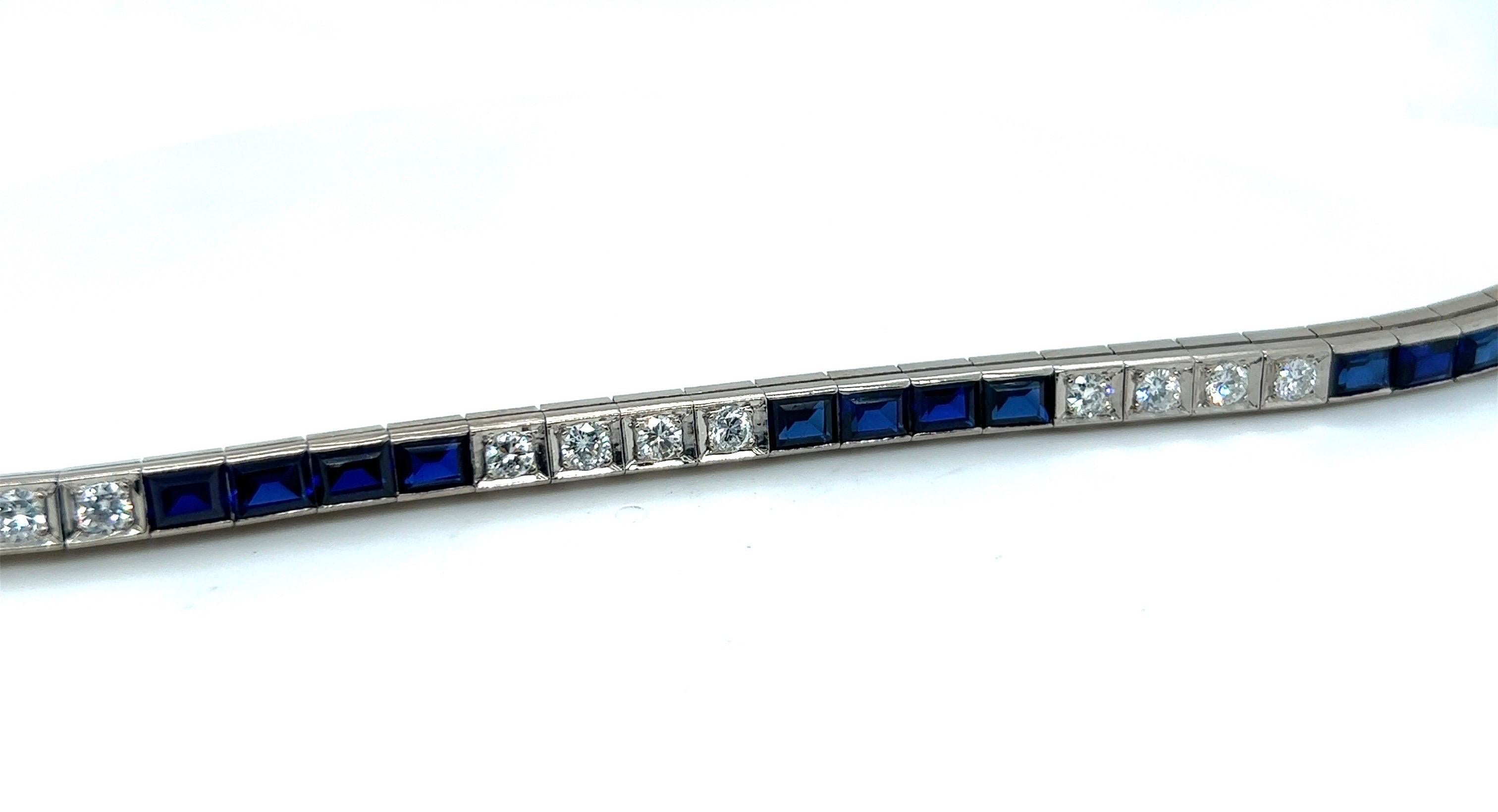 Elegant 14 karat white gold, brilliant-cut diamond and synthetic sapphire rivière/tennis bracelet. 

Attractive rivière bracelet, alternatingly set with 20 brilliant-cut diamonds weighing circa 2 carats, respectively 20 synthetic sapphire baguettes