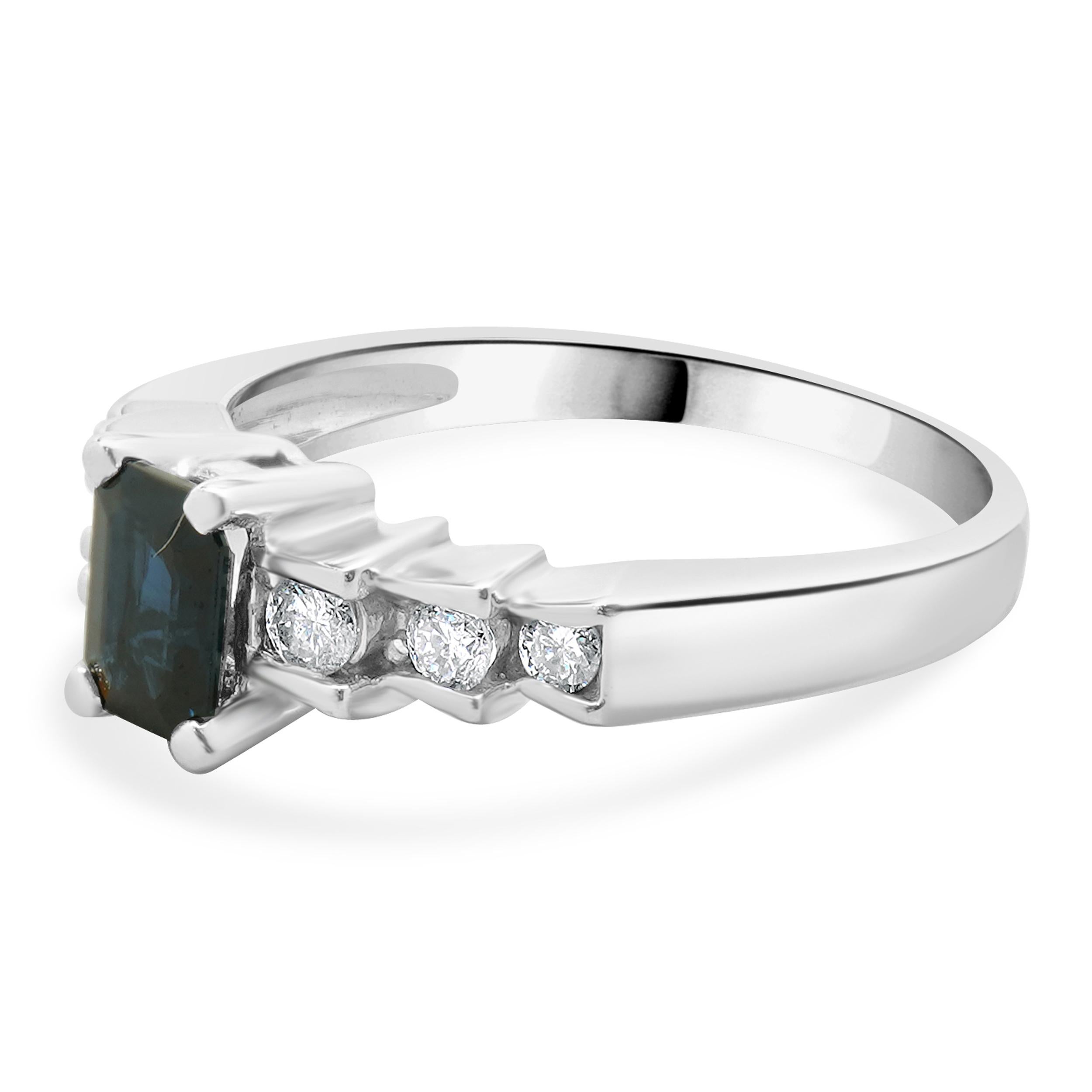 Designer: custom
Material: 14K white gold
Sapphire: 1 emerald cut = 0.48ct
Diamond: round brilliant cut = 0.18cttw
Color: G
Clarity: SI1
Ring Size: 7 (please allow two extra shipping days for sizing requests)