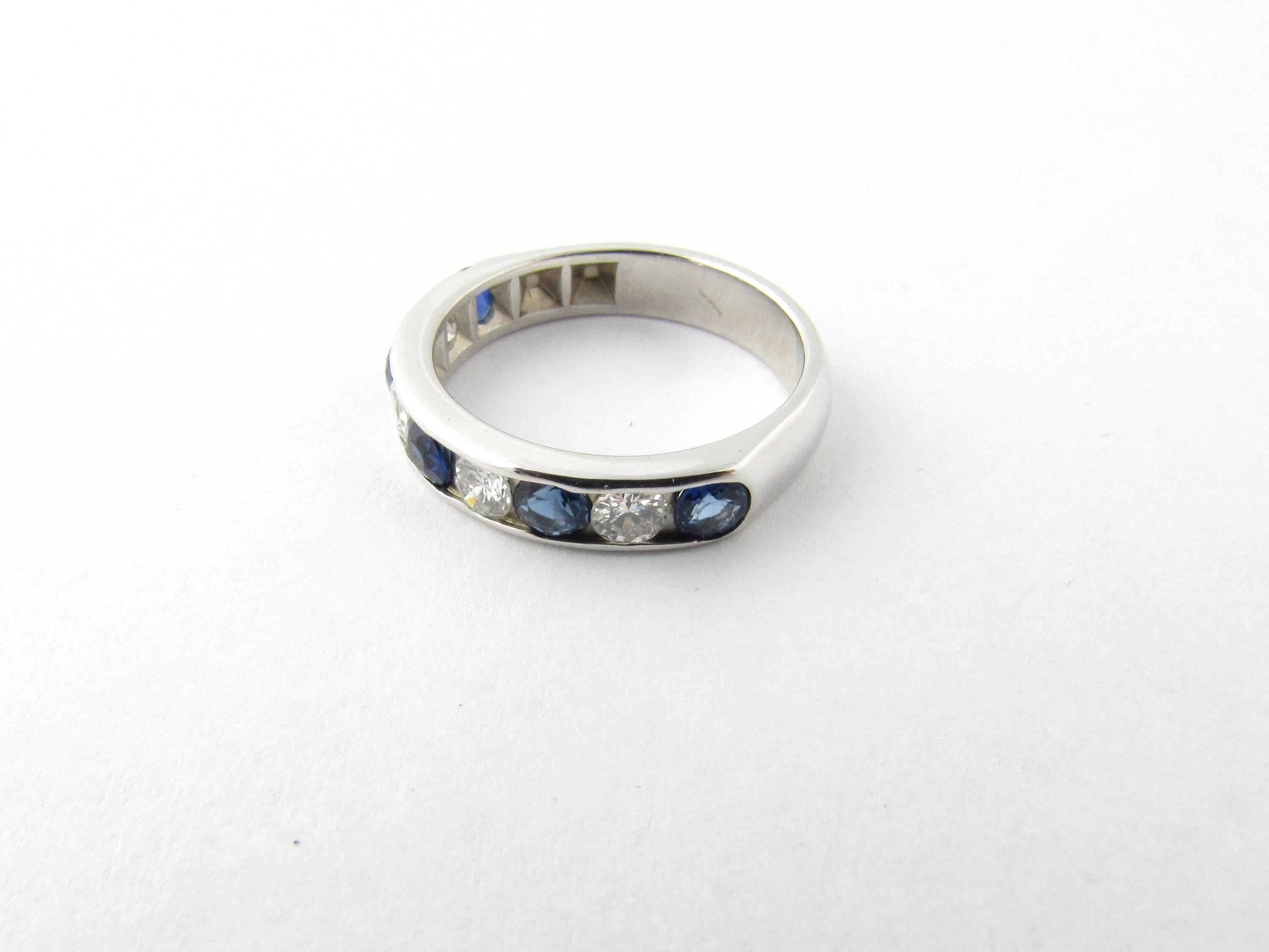 Vintage 14 Karat White Gold Sapphire and Diamond Wedding Band Size 3.75- 
This stunning band features four round sapphires and four round brilliant cut diamonds set in classic 14K white gold. Shank measures 3.5 mm. 
Approximate total diamond weight: