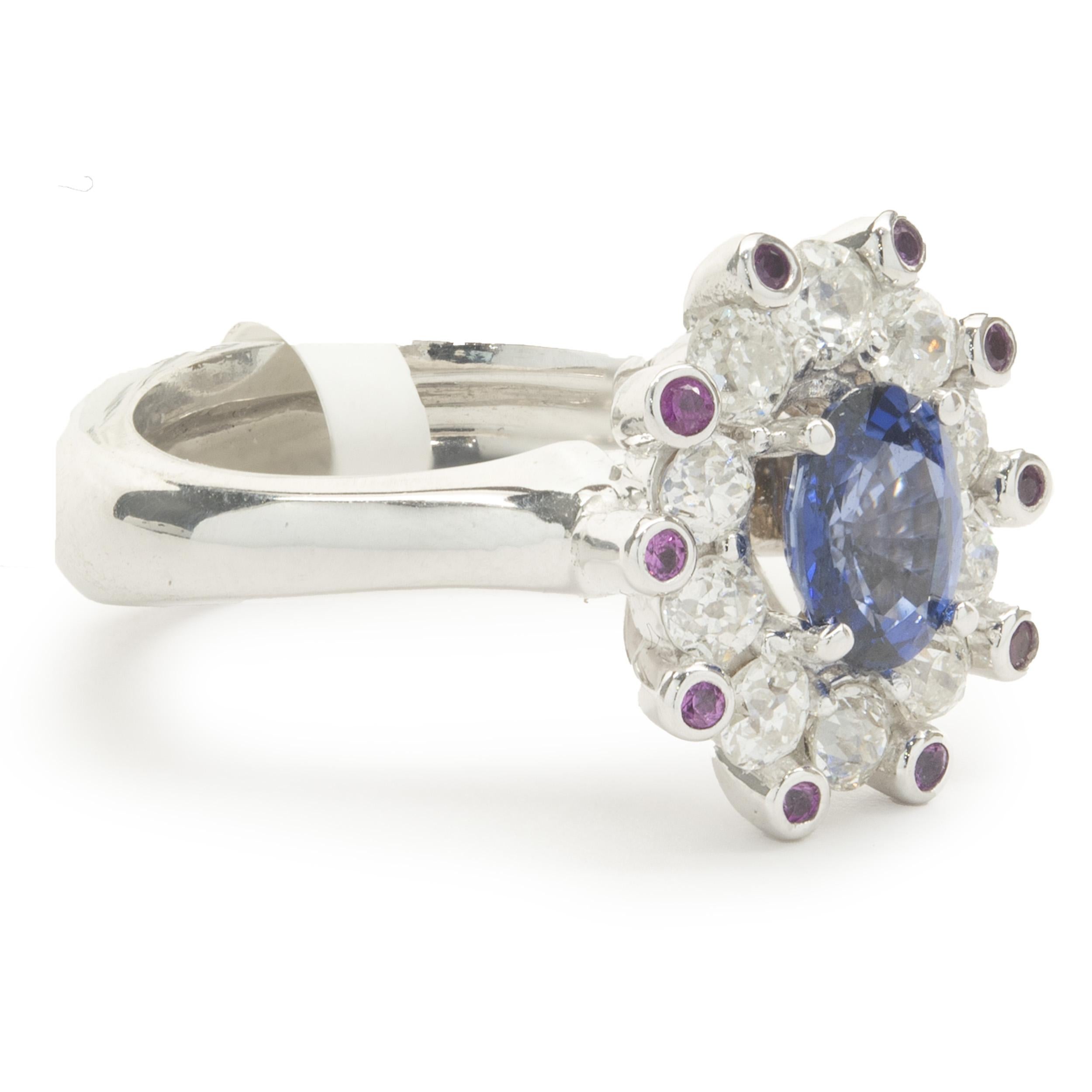 Designer: custom
Material: 14K white gold
Diamond: 12 round rose cut = 1.65cttw
Color:  I
Clarity: SI1
Sapphire: 1 oval cut = 1.70ct
Color: Royal Blue
Clarity: AA fine gem quality
Dimensions: ring top measures 16.60mm wide
Ring Size: 7.5