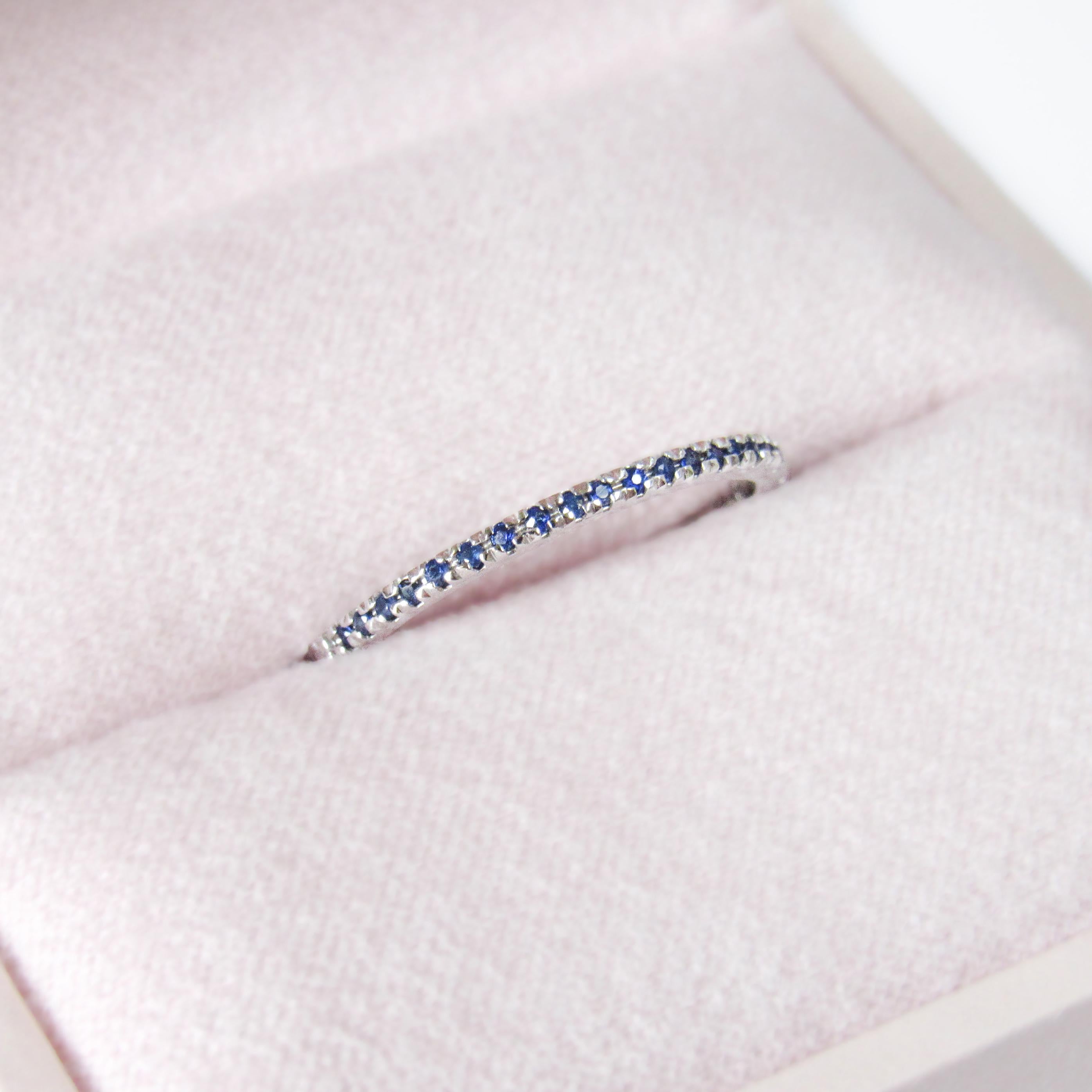 MADE TO ORDER *Please note that we take 30 business days to create your jewel before its ready to ship.  (Please specify your size).

This 14 karat white gold band holds some lovely medium blue sapphires. The sapphires have been set on half of the