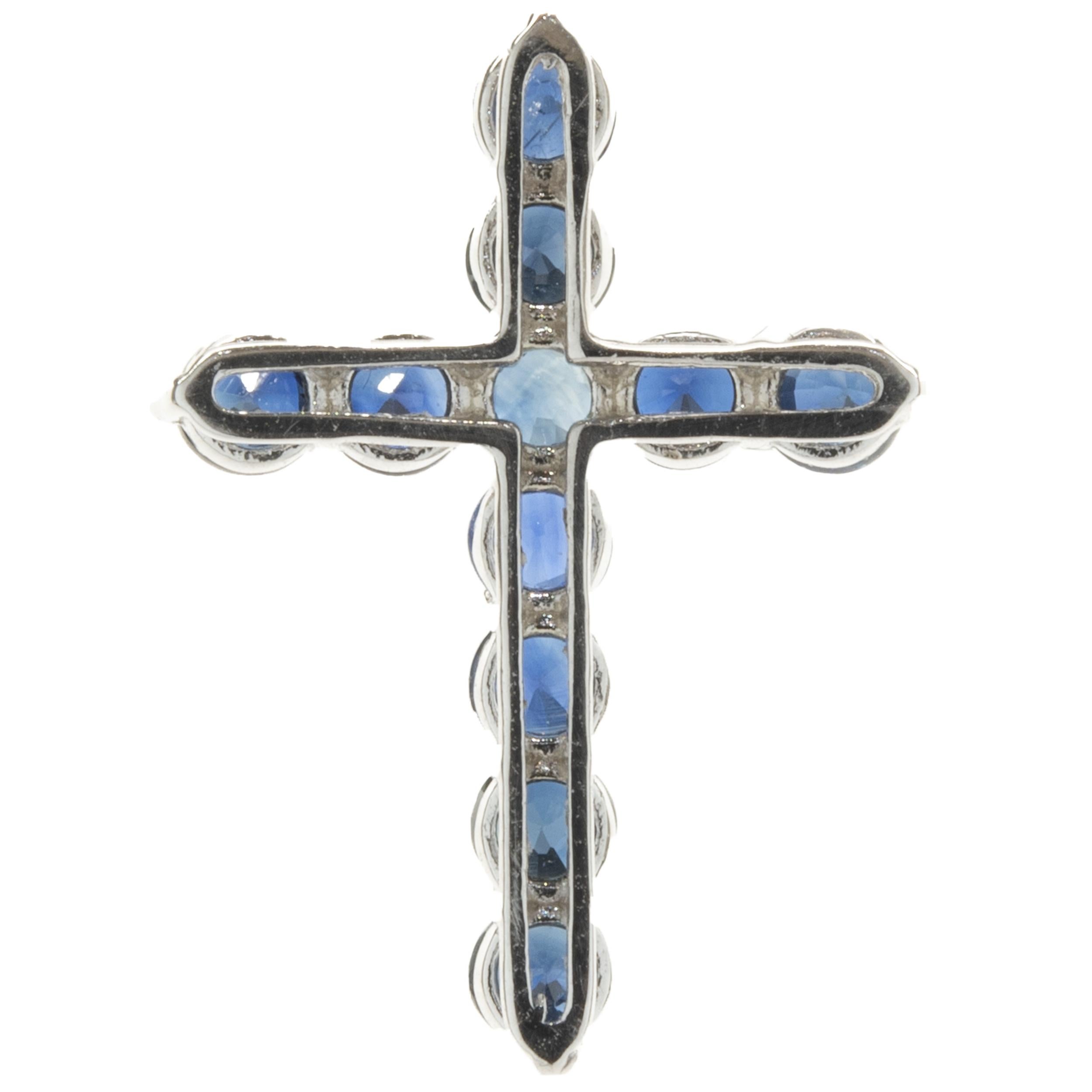 Designer: custom
Material: 14K white gold
Blue Sapphire: 11 round cut = 1.25cttw
Dimensions: cross measures 22.7 x 16.25mm
Weight: 1.25 grams

